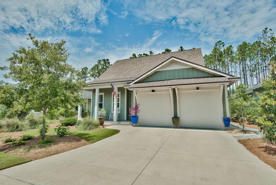 This Popular Coral Bean Plan features the master and guest suites on the main level. Situated on a prime manicured lot, this home features hardwoods throughout the main level, well appointed kitchen with stainless appliances, dining room and large family room with access to inviting screen porch. Large secondary bedrooms and upgrades throughout this home. Private fenced back yard with outdoor shower, plenty of storage. Home is immaculate and ready for you!
