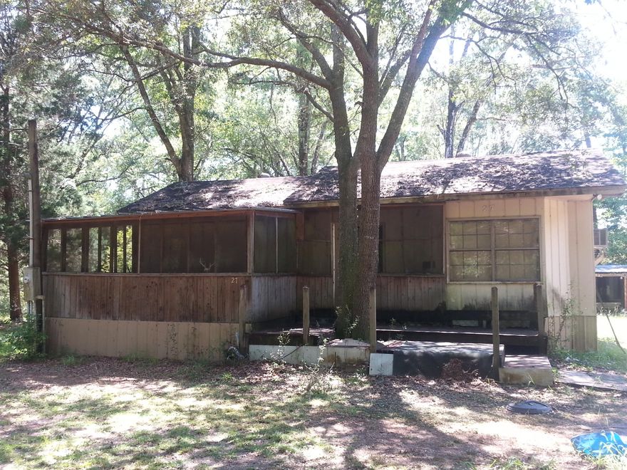 Beautifully wood parcel with large oak trees. There is an old cabin (1bed/1bath) on the property.  It's truly a fixer upper! There is an existing well with no pump, septic and power pole on the property all being sold ''AS IS''.  This property is unrestricted,  No HOA.Flood Zone X and Walton Co GIS shows No Wetlands.Property is approx. 15 mins from Freeport.  Also, centrally located between Destin and Panama City FL in close proximity to Morrison Springs, (2) boat ramps providing easy access to Choctawhatchee Bay via Black Creek and only 20 mins to Grayton State Park in Santa Rosa Beach.Information contained within this listing is deemed to be accurate but is not guaranteed. Buyer to verify.