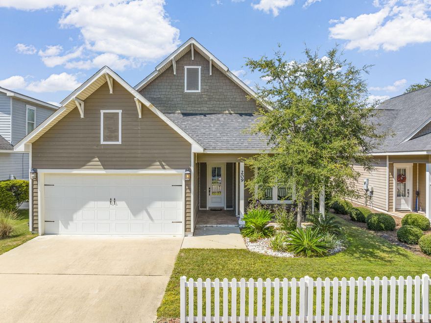 Discover Paradise Cove--a charming community where every home is framed with a classic white picket fence and neighbors enjoy a relaxed coastal lifestyle just minutes from the beaches of Seaside, Seagrove, and Grayton. Built by Boswell Builders, one of the area's most trusted luxury home builders with over 45 years of experience, Paradise Cove offers timeless craftsmanship in a setting designed for full-time living. (No short-term rentals allowed.) 
This single-story, 3-bedroom, 2.5-bath home features an open and airy layout with 10' ceilings, crown molding, and rich hardwood flooring throughout the main living areas. The gourmet kitchen is designed to impress with granite countertops, stainless steel appliances, and custom cabinetry with soft-close features. The spacious primary suite includes dual vanities, a whirlpool tub, a separate walk-in shower, and an oversized walk-in closet.

Additional highlights include an oversized two-car garage, single-level living, and access to resort-style community amenities such as a neighborhood pool with cabana and bathrooms.

Ideally located, Paradise Cove is convenient to top-rated schools, shopping, dining, Eden Gardens State Park, the public boat launch to Choctawhatchee Bay and the Intracoastal Waterway, and all the best of 30A.

Experience the perfect blend of luxury, location, and lifestyleyour coastal retreat awaits at 209 Blakely Drew Blvd.
