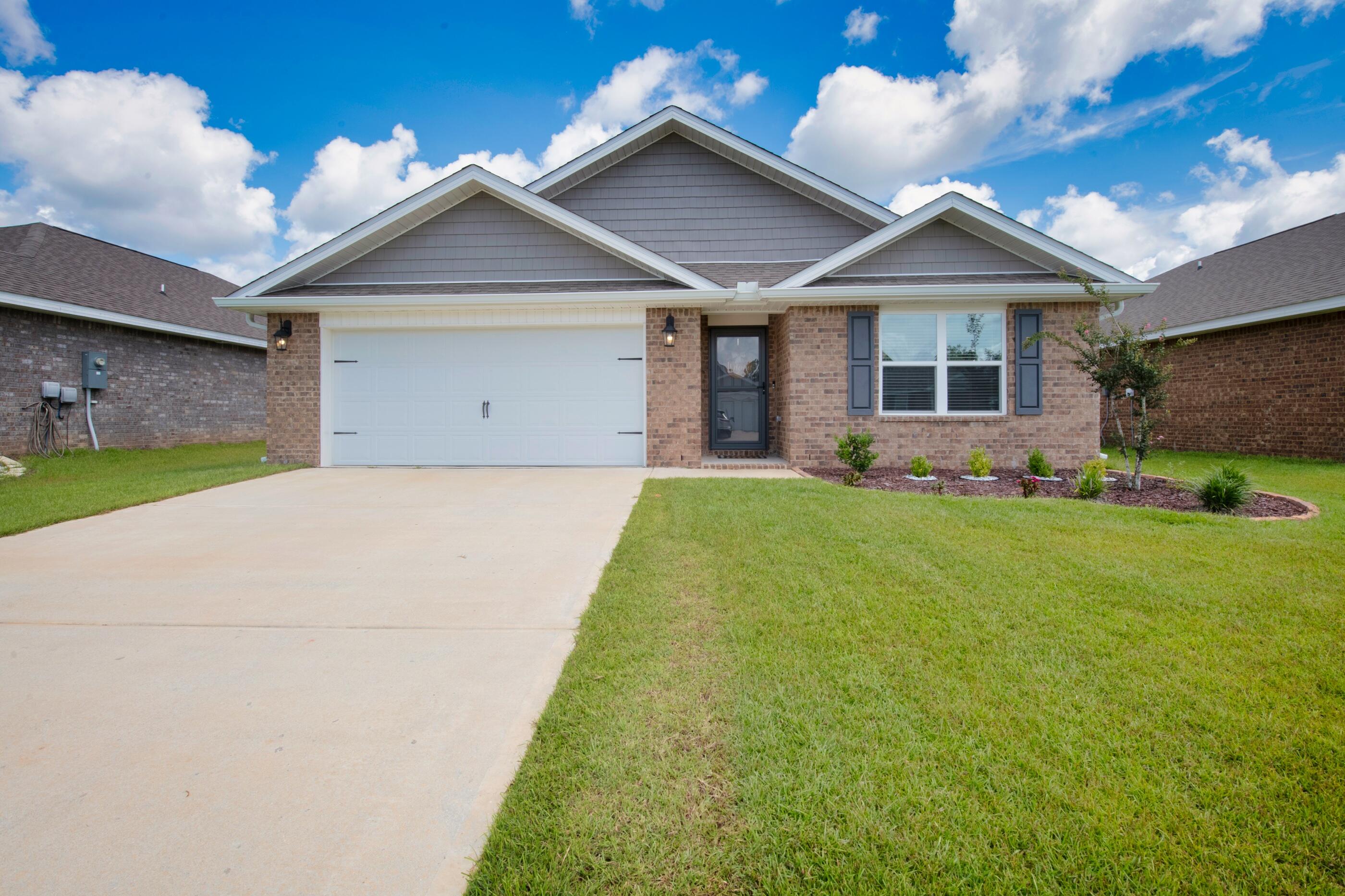 Stunning 4 bedroom, 2 bath home in Redstone commons complete with a covered back porch, 2 car garage, and fenced in backyard. The open kitchen features a spacious island, stainless appliances, and granite countertops. The kitchen opens to the great room with easy access to the covered porch. The primary suite is just off the back side of the house & primary bath features a walk-in closet, dual sinks, and a large shower.
