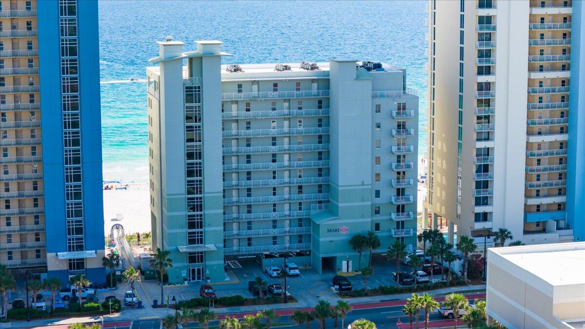 CASH FLOWING BEACH FRONT INVESTMENT! Already on a vacation rental program and comes fully furnished and turnkey. This is a MUST SEE in person...the pictures do not do it justice! This Amazing unit has 2115 Sq ft with High End updates throughout, New Quartz Countertops and Backsplash, New Paint on Kitchen Cabinets, & all 3 Baths, HVAC's have been replaced in 2017 and 2019. New Doors, The S/S appliances in the kitchen are high end Samsung. In laundry room you will find front load Samsung washer and dryer. This unit is in impeccable condition. This unit will make a great 2nd home or Rental. TWO MASTER SUITES each with En Suites with jetted tubs and separate walk-in showers and enclosed toilets. There are only 45 units in the building, and has 2 elevators, so no waiting. This is A Must SEE if you want upscale living on PC Beach. Don't wait! If you are looking for an investment property this can be rented as a 3-bedroom, 4 bedroom or stay in the 3 bedroom and rent out the lockout master suite. This unit shows as if it is brand new! Make this unit your 2nd home or a great investment!