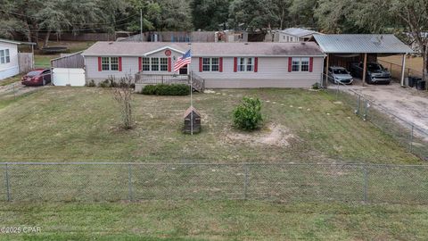 Photo of 907 Court Martial Ranch Road, Southport, FL 32409 (MLS # 990453)