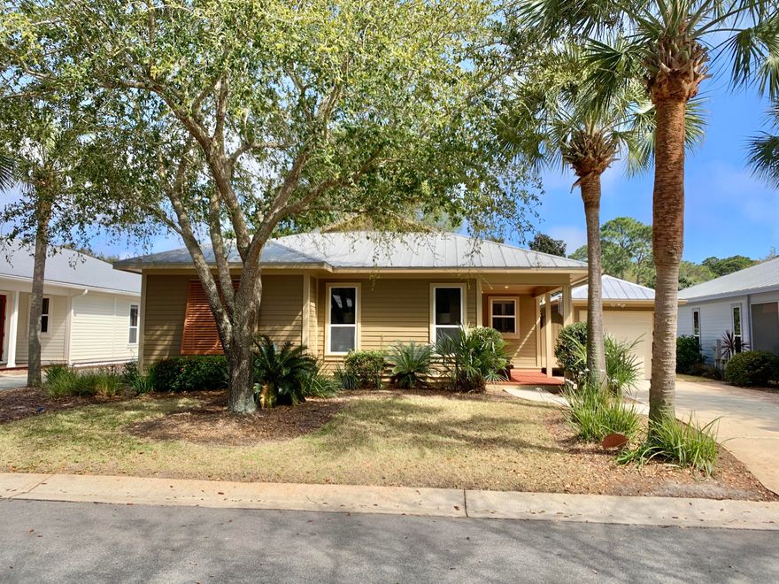 PRICE REDUCED $30,000!!! This adorable cottage has been completely updated and freshly painted just waiting for new owners. Each bedroom has a full bath and lots of windows for maximum light. One bedroom has a walk in closet big enough for a small office if you need one. There are gas appliances that all convey and a one garage too.You will love the screened porch across the back and the outdoor shower when you come in from the beach. It also has a doggy play yard for your little furry friends.It has a very open floor plan and has been staged so you can visualize how rooms could be furnished. It can be bought furnished also and all window treatments will stay.Very easy to show so please just call and we can give you the code.