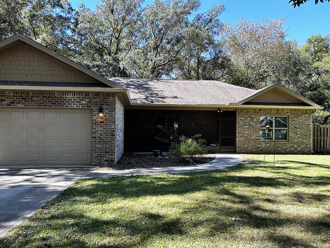 Bring your BOAT to this fabulous home, Waterview Cove. This waterfront community has a private BOAT LAUNCH to a creek just a few feet from Alaqua Bayou and Chocotawhatchee Bay beyond. This lovely brick Craftsman three-bedroom, two-bath home features an open floor plan with vaulted ceilings and laminate wood floors.  White cabinets make the kitchen shine with granite countertops and tile floors. You will enjoy the outdoors with two screened front and back porches--a treed backyard with privacy fencing.  Waterview Cove is an established neighborhood known for its gracious oak trees and laid-back atmosphere. See this fabulous home today!