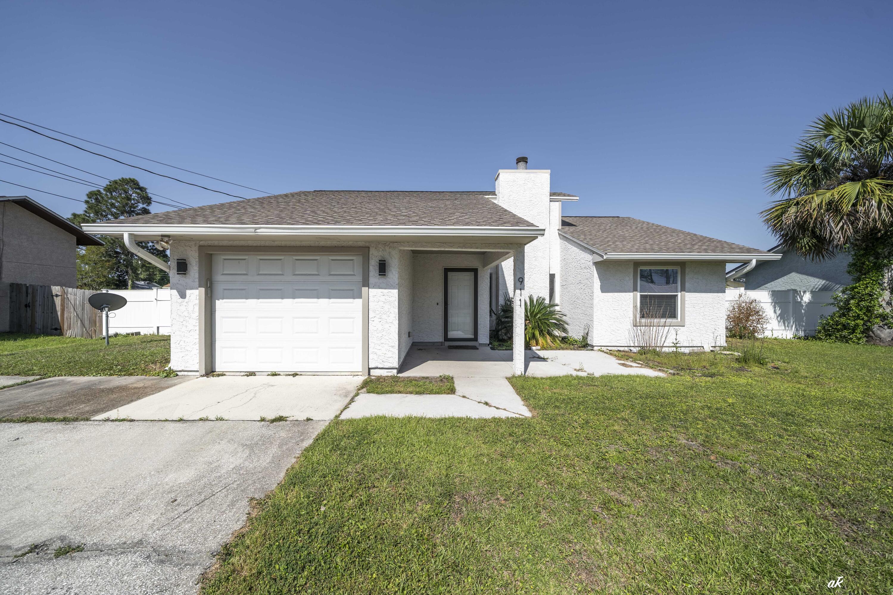 VA assumable loan 5.375% interest.COMPLETELY REMODELED HOME. Stunning 3-Bedroom Home in Prime Panama City Beach Location Welcome to your dream home in one of Panama City Beach's most sought-after private communities! This beautifully updated 3-bedroom, 2-bathroom home offers over 1,500 sq. ft. of thoughtfully designed living space, making it the perfect retreat for relaxation or entertainment. Ideally situated near Pier Park, top-rated Bay County schools, world-class shopping and dining, and, of course, the breathtaking white sandy beaches, this home delivers both luxury and convenience. From the moment you arrive, the freshly painted exterior and beautifully landscaped yard set the tone for the quality and care that defines this property. Step inside to discover brand-new porcelain tile flooring throughout, elegant, canned lighting in the great room and master bedroom, and a spacious Florida room with brand-new windows, fully heated and cooled for year-round comfort. The great room is truly a showstopper, featuring raised ceilings, a stunning shiplap accent wall, and a wood-burning fireplace, creating a warm yet sophisticated ambiance. The sleek, upgraded kitchen is a chef's delight, complete with new stainless-steel appliances, granite countertops, a stylish tiled backsplash, and a generous pantry. The master suite offers an incredible retreat with ample space, a huge walk-in closet, and an en-suite bathroom featuring a tiled tub/shower. The additional bedrooms, located on the opposite side of the home for privacy, provide spacious closets and versatile space for family or guests. The second bathroom has been tastefully updated with modern tile flooring and a tiled shower. Designed for effortless living, the laundry room flows seamlessly into the garage, adding to the home's practical charm. Outside, the private, fully fenced backyard is perfect for hosting gatherings, summer BBQs, or simply unwinding in your personal oasis. Additional upgrades include: ... New roof ... New AC unit (installed within the last 2 years) ... New water heater (installed within the last 2 years) ... New exterior paint ... Vinyl Privacy Fence This home is truly move-in ready and a must-see! Don't miss your opportunity to own this incredible property in one of Panama City Beach's most desirable locations. Call today to schedule your private showing!