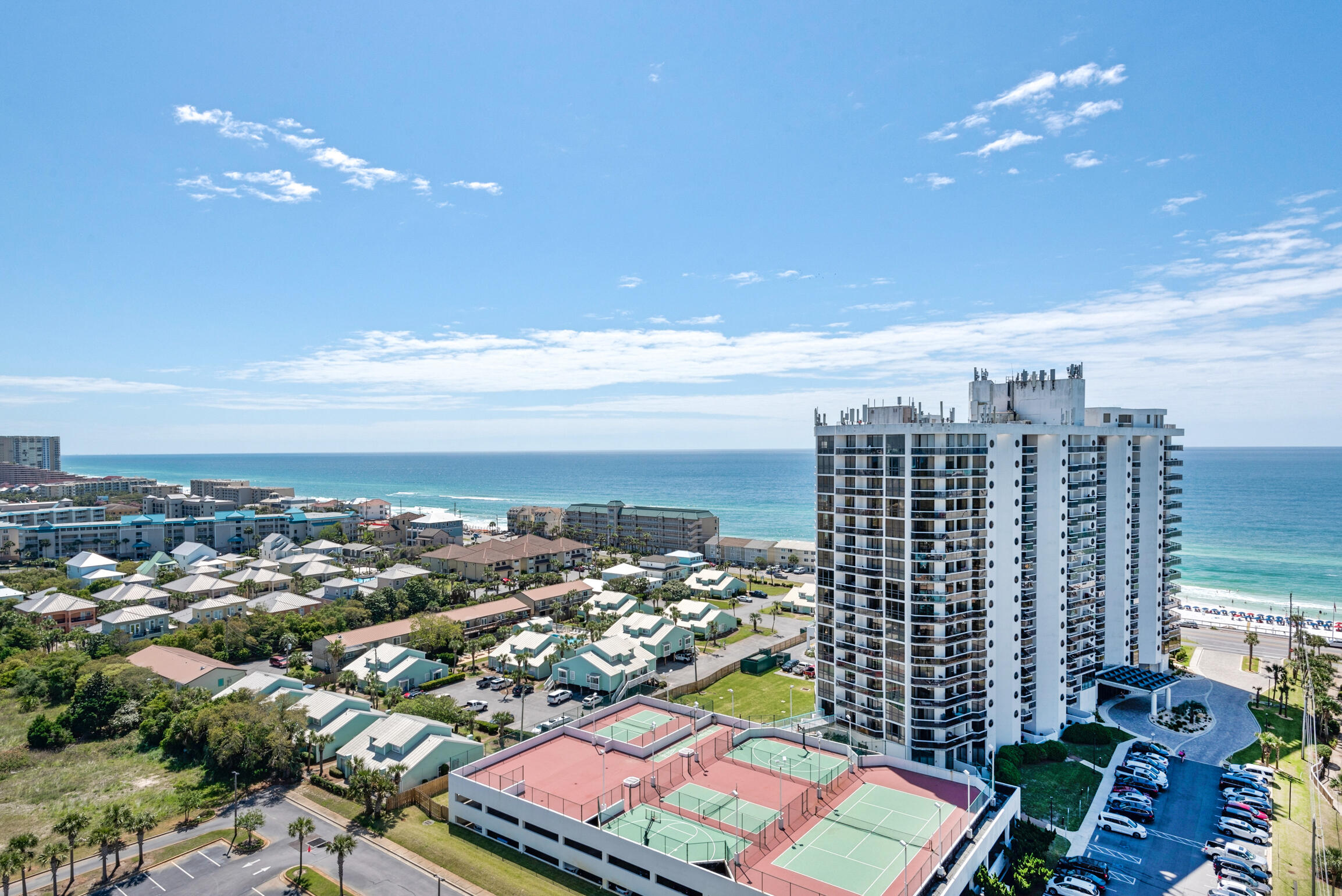 Welcome to your new gated beach community w/ 2,000ft of PRIVATE BEACH! This spacious and stunningbeach condo is one your friends, family and vacationing guests will cherish for a lifetime. Take in beautiful gulf views from your oversized and private balcony. The oversized kitchen showcases endless granite countertops, stainless steel appliances, gorgeous cabinetry, large pantry + more.  NO CARPET! LVP and Tile flooring throughout. Seascape Resort is the most amazing family destination with amenities that include multiple pools, hot tub, tennis courts, an 18-hole golf course, Cabana Cafe Restaurant, bike rentals, and beach service.  300 acres of lush greens, serene lakes and 2000 feet of pristine white sand beach. Soak in the views of the gulf. The wait is over! Come make this your own.