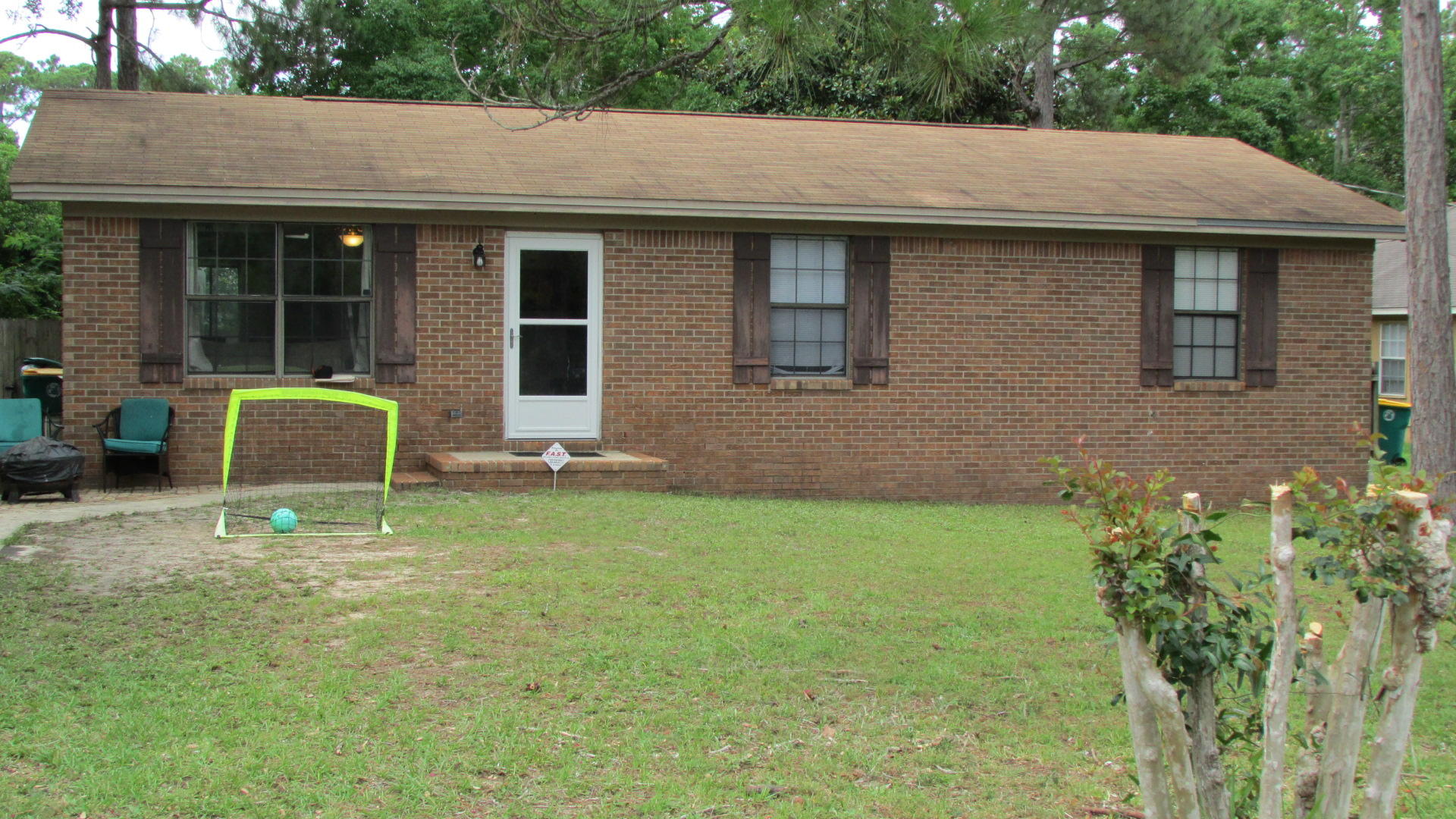 Charming All Brick Florida cottage, with recent updates; including new stove, range hood, refrigerator, dishwasher and yard building. You will appreciate the ceramic tile throughout, no carpet. The large laundry room also serves as a storage room and mudroom. The Seller added special touches such as raised large outlets for Flat Screens TV's and floor level tamper resistant outlets to protect young ones and pets. The open floor plan allows great flow throughout to accommodate all your furniture. The back yard is completely fenced in and perfect for pets and kids! Just minutes from Navarre Beach & Hurlburt Field. Make sure you add this one to your list to see today!