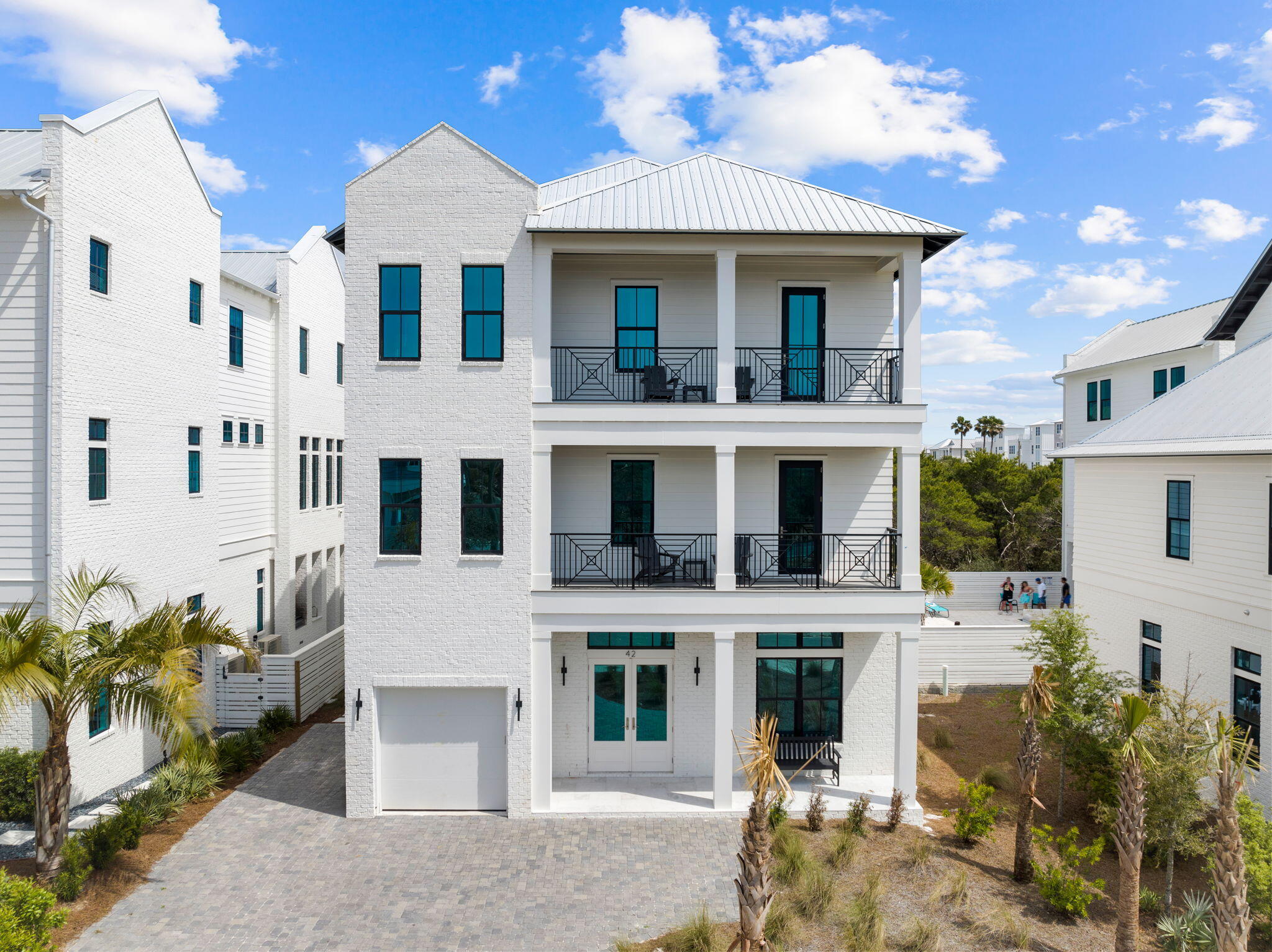 Primely positioned and beautifully designed, this sleek beachside retreat features sweeping gulf views and masterful new construction in the newly developed Seven Palms at Inlet Beach. This impressive home offers a stunning vertical elevation with white-washed parapet walls and striking architectural elements including a fourth story lookout deck. Notably featuring 7 bedrooms and 7.5 baths and 5,485 sqft of living space, this property is an idealistic second home, short term rental investment or primary with exceptional comforts such as a private elevator, resort style pool and spa with a massive rear pool deck and fenced privacy, summer kitchen and four levels of porch space to soak in the endless gulf views and sunset vistas.