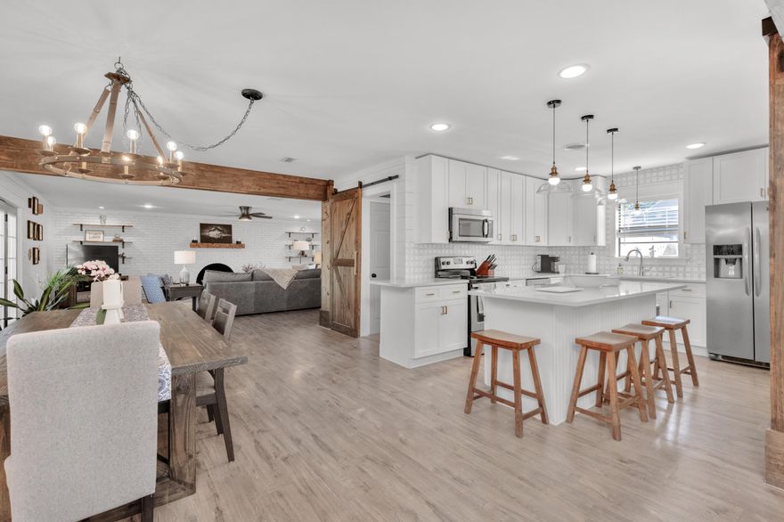 Welcome home to your completely renovated home in the heart of Fort Walton beach! This open floor plan is perfect for entertaining. Enjoy features such as shiplap, brass and iron accents, stained wood beams, a brick wall with a fireplace in the living room, laminate wood floors, and new window and door trim. If that's not enough for you, your new open kitchen features quartz countertops, Carrara marble backsplash, shaker-style cabinets, stainless steel appliances, an oversized stainless steel kitchen sink, and a large island with a wine cooler. Your bedrooms and bathrooms have also been updated included a luxurious master suite with his and her closets, soaking tub, walk-in shower and more! Your new home sits on a larger lot with no HOA. Roof and new wiring since 2020. Schedule a showing!