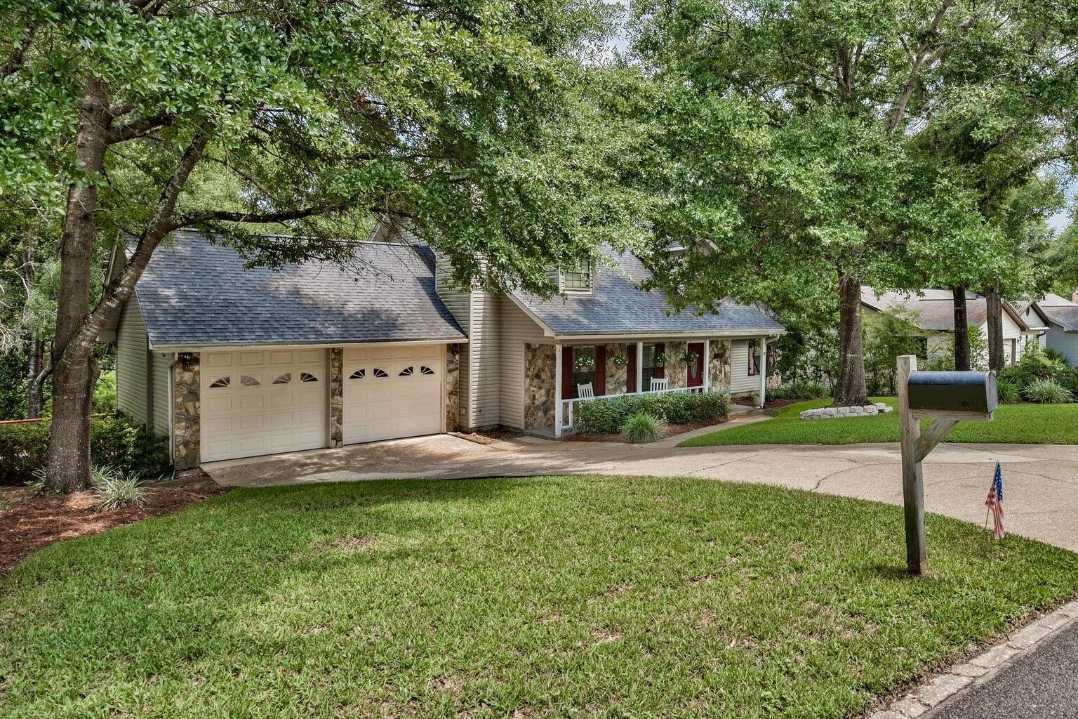 108' of private lakefront in the popular community of Rocky Bayou in Niceville! This home is an entertainer's delight with a HUGE yard, oversized kitchen with dramatic center island and a deck big enough to throw a party! And with double ovens and a side by side fridge, you can whip up hors-d'oeuvres for the whole crew! If you are looking for something a little more restful, try feeding the turtles or drop a fishing line. Or you can sit a spell in a rocker on the shaded front porch. The primary bedroom and bath are downstairs and 2 additional guest bedrooms are upstairs along with a full guest bath. There is also a 2 car garage and walk in attic storage. Don't miss out on the opportunity to make this house your own - schedule a viewing today! Call 850-729-0399 View rental requirements