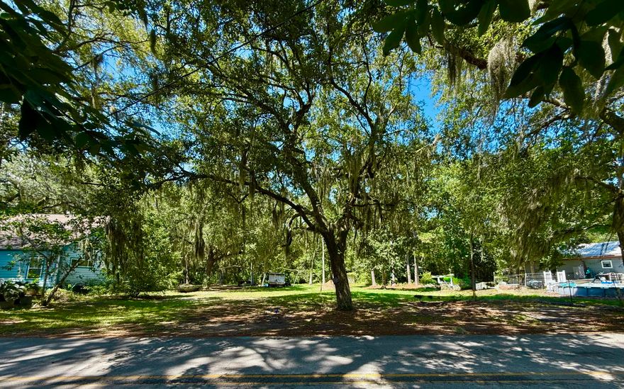 A Bay View Retreat Waiting to Be DiscoveredTucked away on a quiet road shaded by towering live oaks, this cleared lot offers more than just land--it offers a way of life. From your future front porch, you'll gaze out across the tranquil waters of Jolly Bay, where every sunrise dances on the ripples and every sunset paints the sky in soft golds and fiery reds.Just steps away, the bay invites you to slow down and savor the moment. Launch your kayak for a peaceful paddle through still waters, cast a fishing line from the shore, or simply sit with your toes in the sand and watch the tide roll in. The community's rare bay access, right across the street, is your gateway to quiet mornings and starlit evenings on the water. This lot has the water tap paid and in. Sewer avail. through City Here, nature sets the pace, but you're never far from the conveniences of life. Just minutes away, the City of Freeport offers small-town charm, while the white sand beaches of 30A and the vibrant energy of the Emerald Coast are only a short drive from your doorstep.

No HOA. No flood insurance required. Utilities at the road. All that's missing is your vision for a custom home or investment retreat that embraces the rhythm of bay life.

This isn't just property...it's a place where the water calls, the trees whisper, and life moves with the gentle flow of the tides.

***All dimensions shown in listings, plat and/or photos are approximate only. Buyer will be responsible to complete due diligence to ensure accuracy of all information. 

