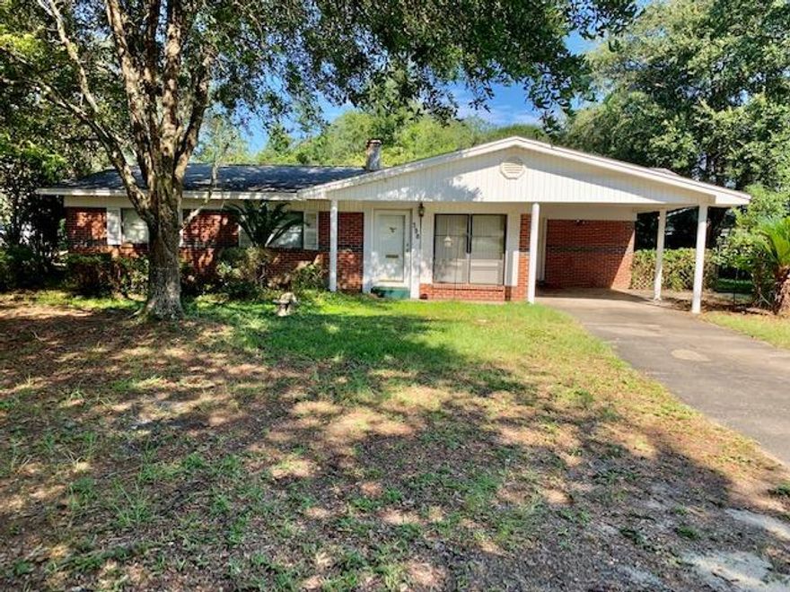 Wonderful opportunity located in desirable Valparaiso, just minutes from Eglin AFB. This 3 bedroom, 2 bath BRICK home is ready for you to make it your own! Features two generously sized living rooms and a cozy fireplace with brick surround.The kitchen offers an abundance of cabinetry and countertop space, and a pass through to the dining room with breakfast bar. This home comes complete with an attached carport, and a detached 2-car garage.This home is being sold AS-IS.