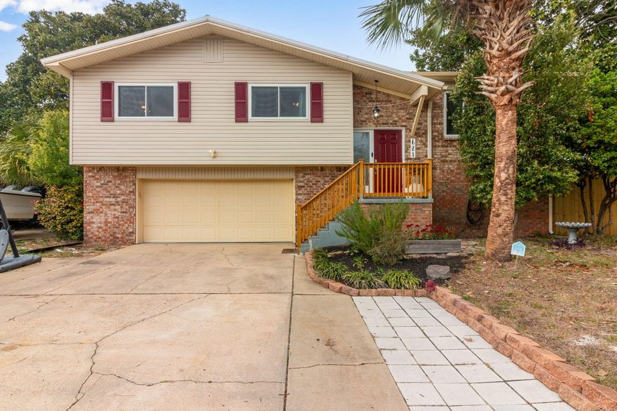 Welcome to this exceptional 4 bedroom, 2.5 bath home in the heart of Destin a rare offering with no HOA, a large corner lot backyard, and your own private pool. With approximately 2,289 square feet of living space this home blends comfortable everyday living with the sunshine lifestyle for which Northwest Florida is known.Come inside to a practical split foyer floorplan that creates a spacious feel on every level. The downstairs gas fireplace offers a cozy ambiance, perfect for chilly days at the beach. Outside, the oversized corner lot backyard provides plenty of room for outdoor enjoyment, gardening, play and entertaining plus a refreshing in ground pool that's ideal for warm Florida days.Location is everything and this home delivers. You are 0.8- 1.0 miles from public beach access.