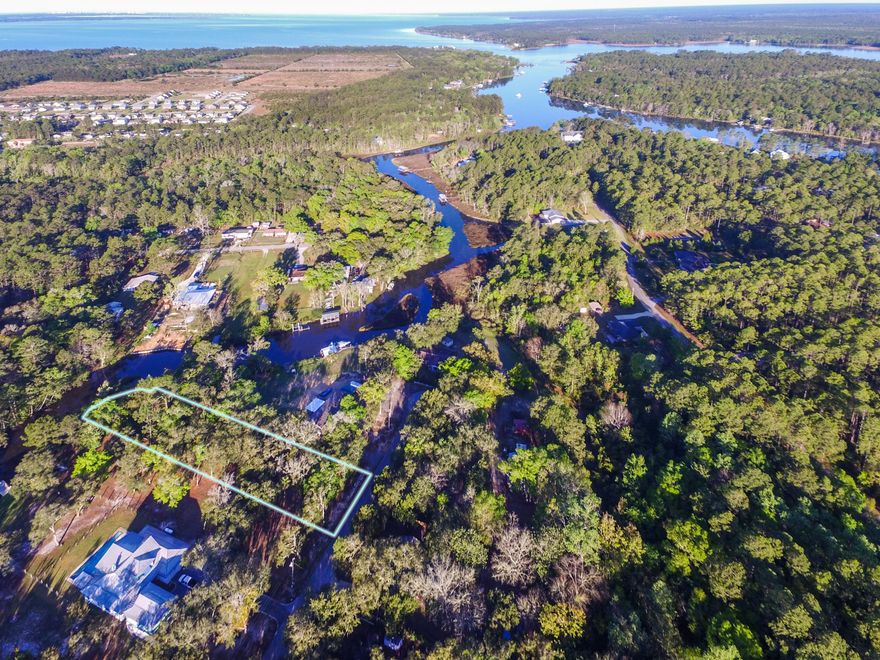 Beautiful large canal front homesite off Mallet Bayou in Freeport. This bayou leads to Lagrange Bayou and the Bay. Located on Carol Place close to the end of the cul de sac. It is wooded and features beautiful oaks, magnolias and pine trees. It is a deep lot allowing plenty room for building.Freeport is hustling and bustling with the new Publix and the 4-lane highway. Get to the beach faster with the new bridge. If water frontage has been on your bucket list, this is a great opportunity to own almost 3/4 acre on the water just 15 minutes from the beach.