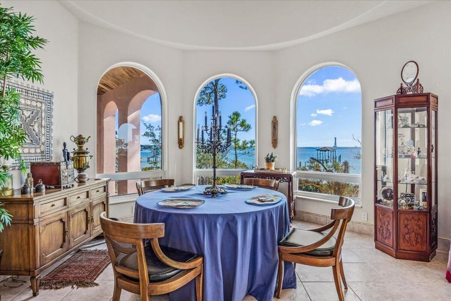 PRICE IMPROVEMENT on waterfront estate! This custom Mediterranean-style home with durable ICF construction, offers unparalleled elegance and breathtaking views of the Santa Rosa Sound. Step inside to discover exquisite details at every turn. The home exudes elegance, featuring dramatic floor-to-ceiling columns, handcrafted doors and a spectacular Mahogany staircase that leads to 2 beautifully appointed rooms. Master suite is a haven of comfort & sophistication, with a cozy sitting area and pass-through gas fireplace that adds warmth & charm. Geothermal HVAC. Experience the serene beauty of 295' of private waterfront from your covered patio, complete with elegant cypress wood ceilings, offering the perfect place to relax and take in the breathtaking views. Schedule a private showing today!
