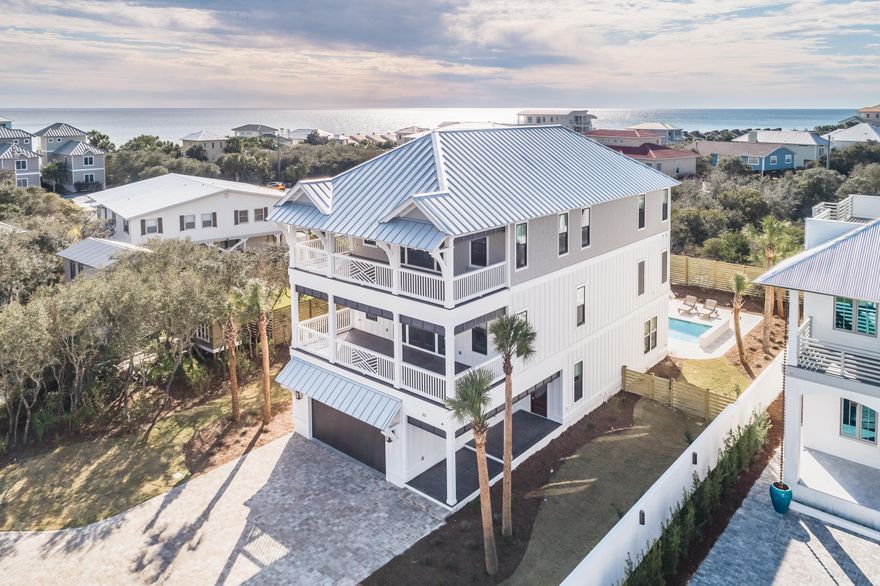 Welcome to coastal luxury living in this newly constructed house located in the heart of Seacrest Beach with deeded beach access at Green St! This home features 5 bedrooms, 5 full baths/2 half baths, along with numerous amenities for you to enjoy the perfect beach life. The house has three stories, two of which have amazing gulf views. The first floor living area overlooking the pool is a great place to enjoy winding down at the end of the day. The beautifully appointed kitchen located on the second floor has all Thermador stainless steel appliances, quartz countertops, custom cabinets, 2 dishwashers, and even a refrigerator that will open and close itself.Not only is the house itself stunning, but the outdoor area will be the envy of everyone.