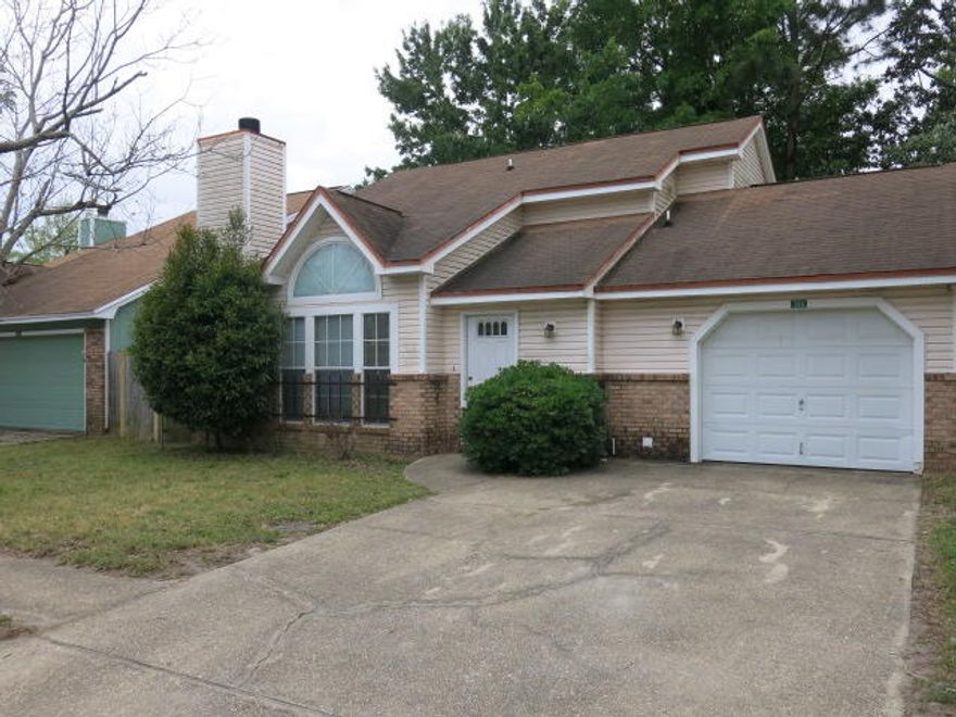 ATTENTION  --ideal for FLIPPING, RENTING, or creating your dream home.--Opportunity Awaits high-performing rental, making it a smart choice for investors or flippers with some sweat equity, this gem can shine again CLOSE to EGLIN AFB This charming 3-bedroom, 2-bath home with DOWNSTAIRS MASTER is packed with potential. Livingroom has VAULTED CEILINGS and FIREPLACE and FENCED YARD. Open concept kitchen includes a breakfast bar, rich oak-colored cabinets and countertops, and sliding glass doors that open directly to the privacy fenced backyard. sliding glass doors that open directly to the privacy fenced backyard. Master Bedroom is on 1st floor, full bath and 2 closet, sliding glass doors. Upstairs 2 guest  bedrooms and a full bath! Won't last long! CALL TODAY!