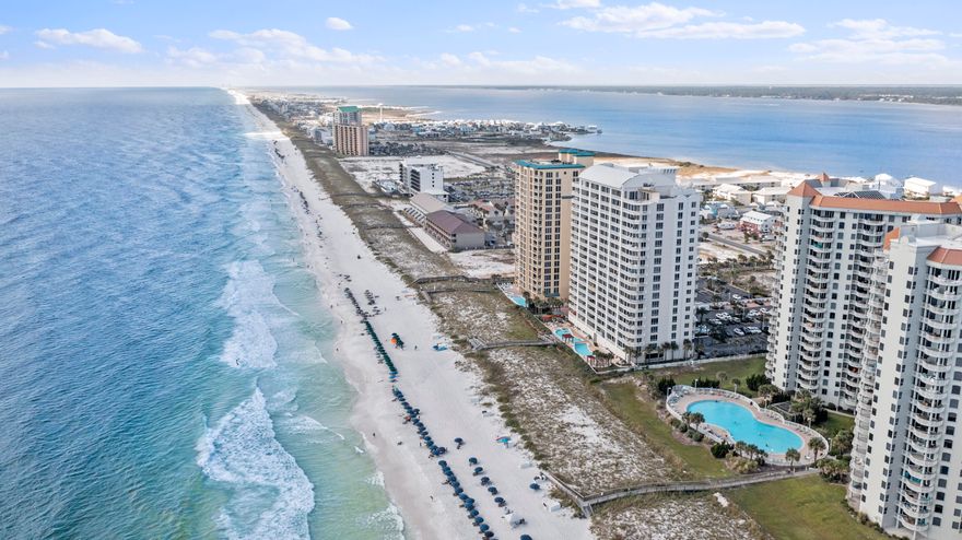 Welcome to Paradise! Navarre Beach is known as Florida's most relaxing beach and this 2 bedroom, 2 bath condo at Beach Colony Resort can be your slice of Heaven. Enjoy some of the best views on the beach from this gorgeous, East Tower, 5th floor space. Beach Colony offers resort-style amenities and features, including the largest pool on the island, charcoal BBQ grills, tennis courts, a community room and fitness center as well as private beach access.From the spacious, curved balcony you have a great vantage point out to the Navarre Pier, the Gulf's longest, on your East and to the West, amazing Sunsets and it is accessible from both the main living area and the master bedroom. The unit has been recently updated and is being offered fully furnished.