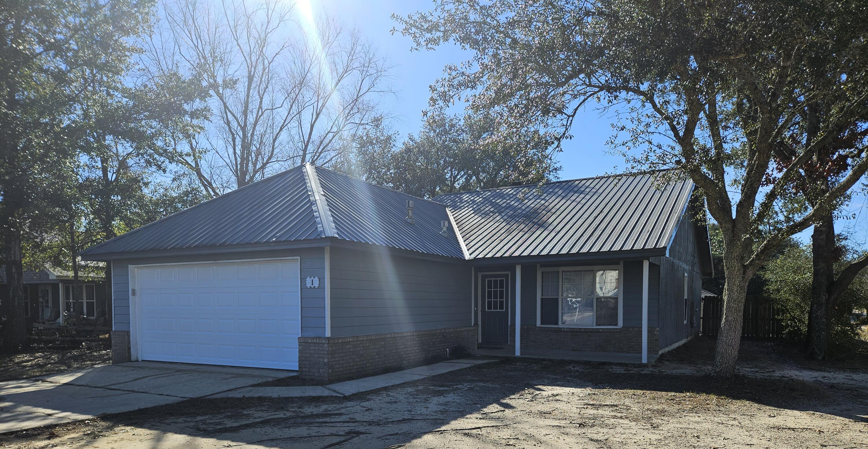 Newly remodeled 3 bed 2 bath home on a corner lot with a short drive to military bases. Newly painted throughout with new LVP flooring in bedroom areas, The kitchen has new stainless steal appliances, freshly painted cabinets with lots of room for storage, eat in kitchen, small breakfast bar and pantry. The Livingroom boast a brick wood burning fireplace and large sliding glass doors that lead out to a covered patio. Large fenced in backyard with shade trees. This property will not last long!