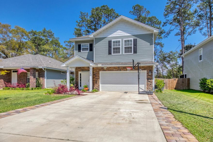 Newer centrally located home just minutes from Eglin AFB! This beautiful home has a private backyard, fenced in for ample space to relax, play and enjoy!  There is even a summer kitchen!Inside you will love the neutral color paint, open floorplan with a large living, kitchen and dining room overlooking the backyard. The kitchen has gorgeous 42 in upper cabinets, quartz counters, LVP flooring, 10 foot ceilings throughout the 1st floor and crown molding! There is also a half bath downstairs and access to the 2 car garage.   Upstairs has 4 large bedrooms. The 3 additional bedrooms enjoy a spacious hall bath with dual vanity.The master bedroom is good-sized with ample room to have large furniture. The master bathroom