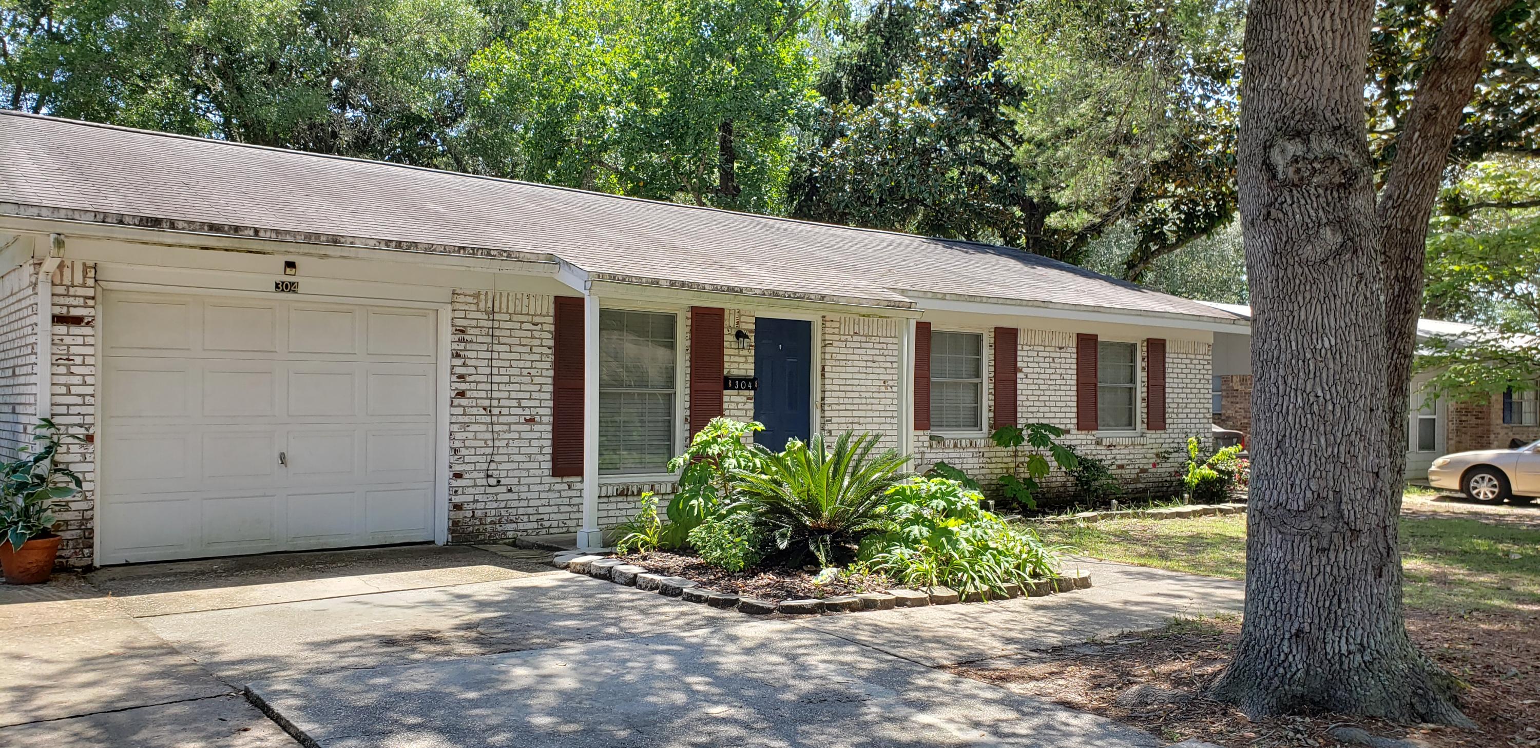 Great 3 bedroom, 2 bath home that still has a 1 car attached garage! The living room is open to the large eat-in kitchen. Step out back and enjoy the covered patio and the huge back yard! No carpeting at all! Tile and faux wood throughout! Pets are allowed with restrictions. Newer Roof!!!