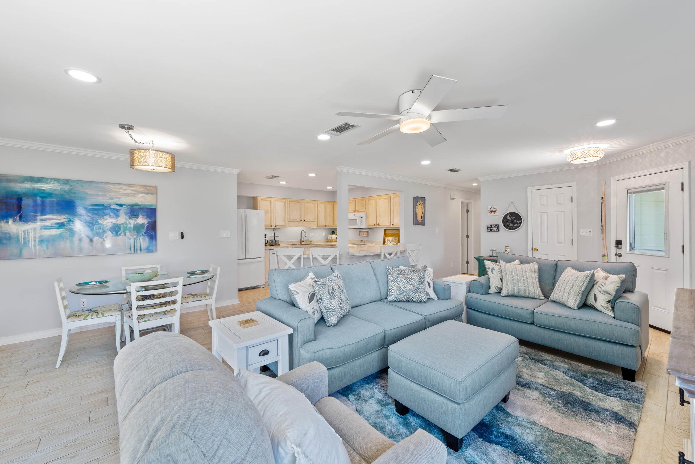 Fully Funished and freshly painted Destin Sands condominiums is a small, quiet, and private community on Holiday Isle of Destin. With beach across the street and docks on the harbor.Take the water taxi or harbor haulers to Harborwalk Village and never worry about parking. Fisherman? Park your boat at your own community docks and begin the trip from your back yard. This ground unit with parking outside the door makes for easy entry and exit. Plenty of windows keep the Destin sun brightening up your day. All appliances are within 5 years old. New Trane A/C installed in 2017. Tile plank floors and bathrooms remodeled in 2016. Included in COA dues are exterior insurance, trash service, water, and sewage. Two closets are in the master bedroom with onelocking in the case of owner's storage.