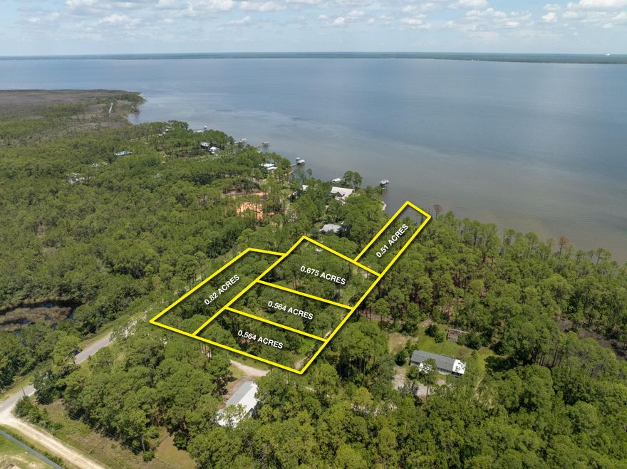 Extraordinary assemblage of (5) contiguous parcels, all of which contain an easement to the waterfront parcel along the scenic Choctawhatchee Bay that contains approximately 76' of prime shoreline.  Please inquire for further details.