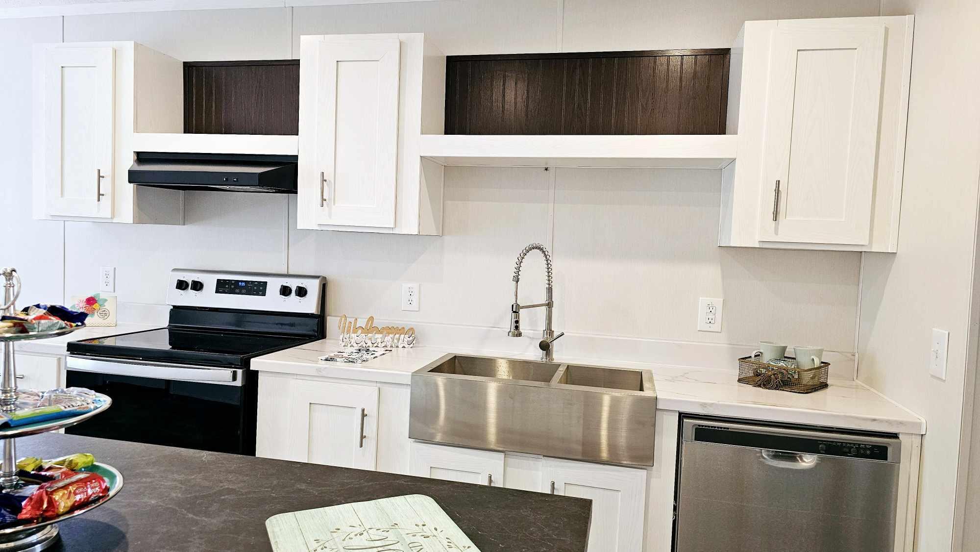 Your dream home is here--brand-new, never lived in, and move-in ready! This stunning 2023 build offers stylish upgrades, spacious living, and a peaceful lakefront lifestyle. Enjoy lake views from your new home and quick access to a nearby boat launch! Open floor plan with cozy fireplace and oversized kitchen island--perfect for entertaining. Gorgeous white oak soft-close cabinets, Moen fixtures, and full stainless appliance package. Luxurious primary suite with double vanities, soaking tub, and frameless glass shower. Built to last with metal roof, Hardie accents, LED lighting, and more. Big fenced yard, no HOA--bring your boat, RV, or garden dreams. Only 3.3 miles to the charming Downtown DeFuniak and 34.5 miles to the white sands of Seaside. Includes 10-year builder warranty--