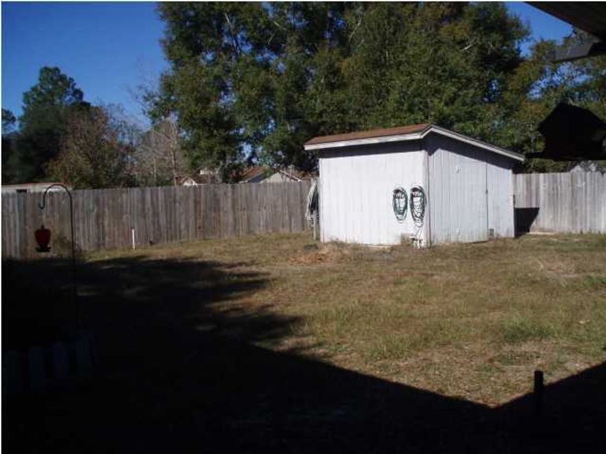 This is an approved short sale just needs a little TLC. 3 bedrooms, 2 baths, living room with fireplace and family room. Covered porch and yard building on this level lot.