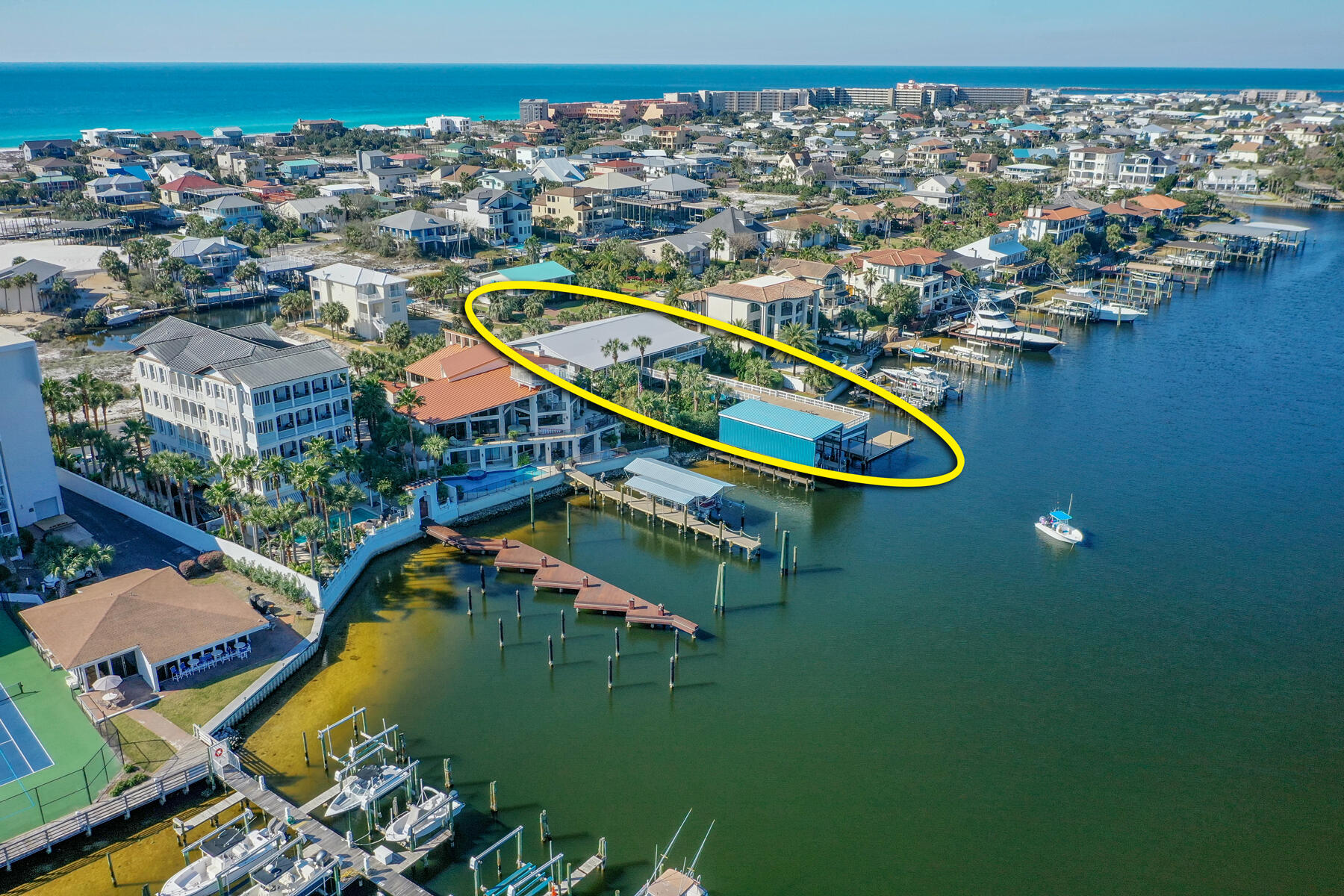 PRICE JUST REDUCED!! Rare 110' of Deep-Water on the Scenic Harbor of Destin, Florida! This incredible property enjoys a quiet, private place on Destin's beloved harbor. It features a fabulous boat house and dock, huge sun deck, abundant outdoor covered decks, a gorgeous pool, and plenty of room for entertaining family and friends! The harbor offers deep-water for fishing and yachting enthusiasts, as well as all types of watersports, plus the property is just a short walk or bike/golf cart ride from the area's stunning white beaches, and a short drive to the Emerald Coast's best dining, entertainment, shopping and more!