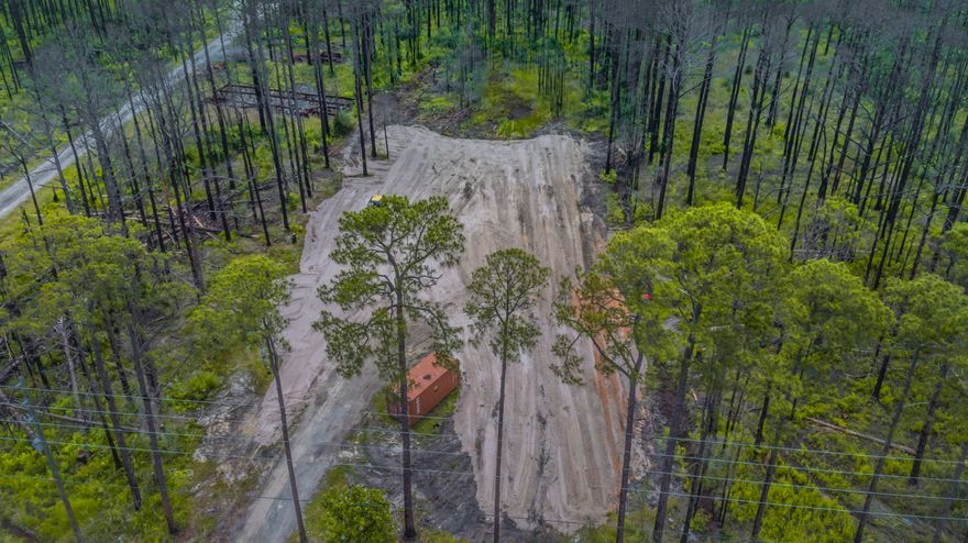 Cleared and ready to build. No Hoa! an acre of land to build what YOU want. 1 mile from the beach! Power water and a grinder pump for sewer already on the property.