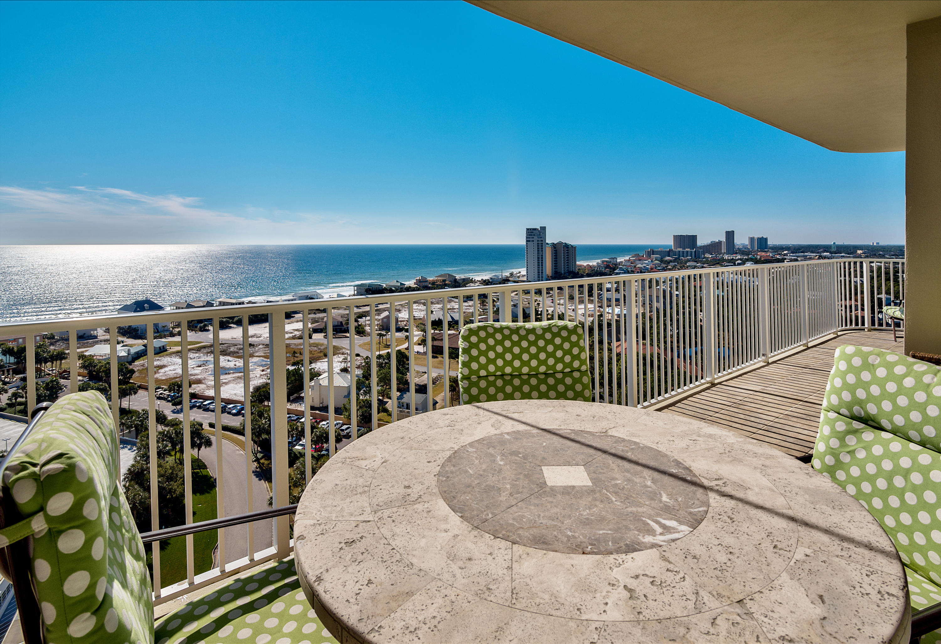 This 17th floor oasis has beautiful views of the white sugar sand and emerald waters of the Gulf of Mexico. Enjoy morning sunrises and relaxing evening winter sunsets from the large private balcony. Travertine floors and crown molding flow throughout and large sliding glass doors allow for expansive views from the main living area. The kitchen is complete with custom wood cabinets, granite counters, breakfast bar, and all stainless steel appliances. The master suite is finished with hard wood flooring, walk-in closet, and master bathroom with large soaking tub, separate shower, travertine floors, and double vanity. The spilt bedroom floorplan has two guest bedrooms and two additional baths.