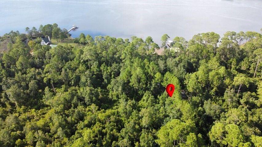 Undeveloped pristine 1/4 Acre Corner Lot with Bay Views in Navarre.Discover Your Slice of Florida Paradise!Embrace the opportunity to own this prime 1/4 acre lot in highly desirable Navarre, Florida. Located on a corner lot with paved road access and featuring beautiful views of the Bay, this property is mitigated, permitted, and prepped for construction!Property Highlights:*Prime corner lot with paved road access*Spectacular Navarre Bay views*Full 1/4 acre of buildable land*Already mitigated and permitted - prepped to clear!*Just 6 miles to beautiful Navarre Beach*Only 15 miles to Hurlburt Field*Less than 2 miles to public boat launch*Perfect for your dream home or vacation getaway.*No HOA restrictions - build on your timeline. This serene property allows you to create your ideal Florida lifestyle while enjoying beautiful bay views. Despite appearing heavily wooded in aerial photos, this is not a landlocked property but a highly accessible corner lot with paved road frontage. Enjoy easy access to water activities via the nearby boat launch, plus convenient proximity to local dining and shopping.
Navarre continues to be one of Florida's most sought-after communities, known for its pristine beaches, friendly atmosphere, and relaxed coastal living. With the convenience of Hurlburt Field just 15 miles away and the gorgeous Navarre Beach only 6 miles from your doorstep, this lot represents an increasingly rare opportunity in an established area with tremendous value appreciation potential.
Don't miss your chance to secure this exceptional property in one of Florida's most beautiful coastal regions. Schedule your viewing today and take the first step toward creating your perfect Gulf Coast retreat.