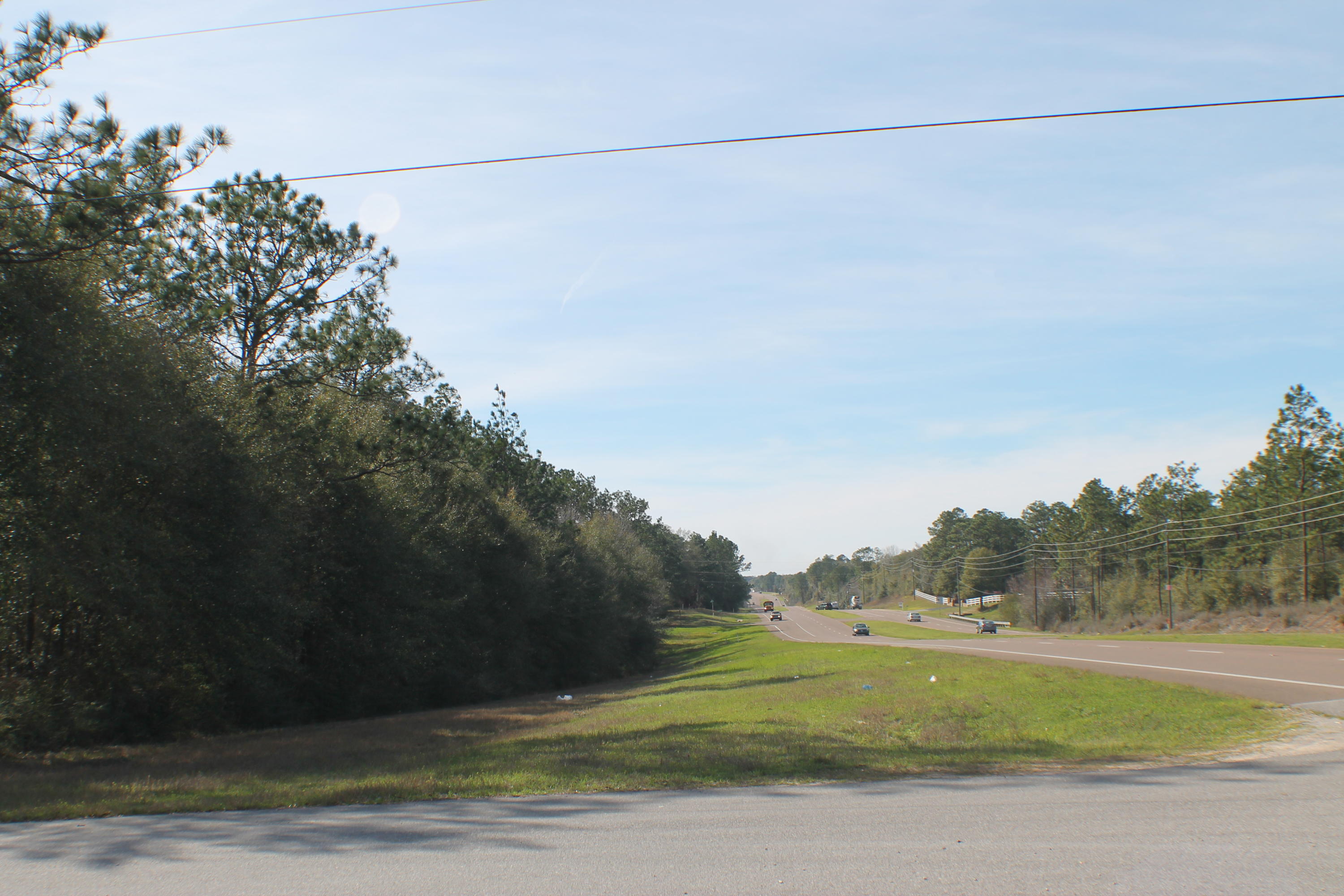 Location large corner lot at Lark Ln and Hwy 90! This beautiful lake lot community is full of late lot estate homes! Bring your floor plan today! This lot is large and across the road from the lake lots. We have a few lots and acreage sites available. Three Lake lots left! See additional mls listings!