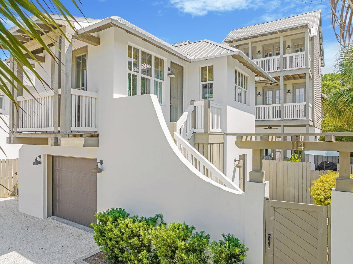 You'll love being within walking distance of the beach, shopping, dining and numerous activities from this five-bed, five-and-a-half-bath home in Costa Carina, a quiet neighborhood adjacent to leafy Rosemary Beach. Spread over 2,314 square feet, this home boasts an open floor plan, a private pool and a carriage house. Dubbed ''Villa St. Thomas,'' the spacious floor plan includes an open concept kitchen, living and dining areas with a cozy fireplace and nearby proximity to a half bath. The second floor hosts a pleasant bunk room, two additional guest suites with king-sized beds and private baths. The entire third floor of the home is occupied by a remarkable owner's suite complete with a king-sized bed, spa-like bath, private balcony and fireplace.