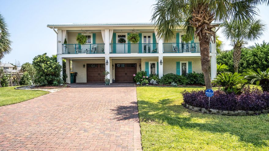OPEN HOUSE 9/17 10am - 2 pm OPEN HOUSE 9/18 11am - 3 pm620 Lagoon is located in the exclusive and sought after area of Destin known as Holiday Isle.  As you pull up to this beautiful two story home, you will notice the immaculate landscaping and oversized driveway big enough for guest parking.  The large two car garage offers ample parking with storage and a great work area.  The garage doors were recently replaced to hurricane code levels.  The first floor features a bedroom with a fireplace and an ensuite bathroom with a separate walk in closet.  The steps leading to the second level immediately give you amazing views of the outdoor deck complete with a hot tub and your very own tiki bar.  Down below, you will find a great lounging area and three boat slips, two have boat lifts.