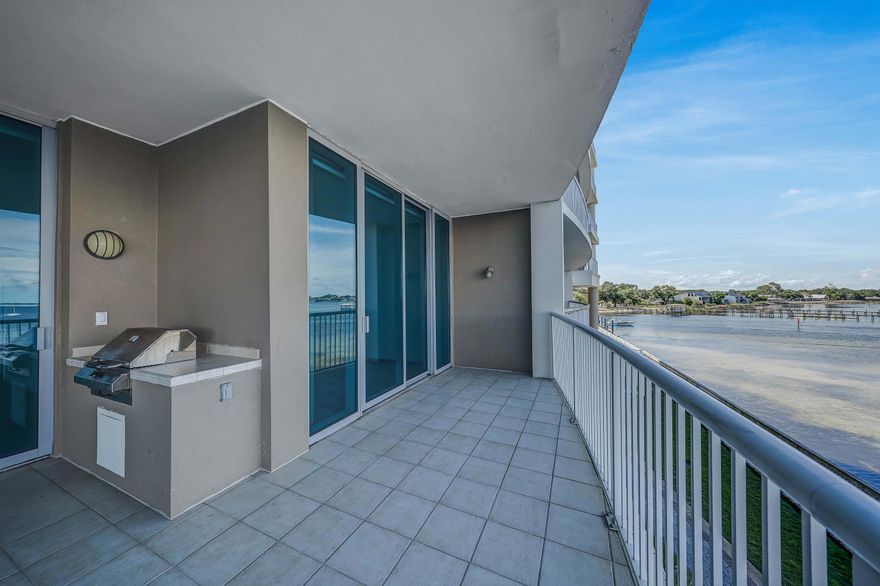Amazing price!  Come see this gorgeous condo and one of the largest balconies on St Andrew's Bay! Your expansive balcony comes complete with a built-in grill. This is amazing for outdoor living and the perfect spot for entertaining friends and family or just relaxing and soaking in your view. This beautiful 2 bedroom, 2 bath unit has been recently painted and is ready for you to move right in! Spacious and open layout with 2 generous sized bedrooms and 2 private baths. Views from literally every room! Extra storage in your exterior owners' closet, conveniently located just across from your condo. Marina Landing amenities include a bay front pool, hot tub, conference room, and fitness room, as well as you are right next to a deep-water marina; so convenient to access the pass, Shell  Island or the gulf waters. Marina Landing is set in a convenient location at the foot of the Hathaway Bridge, and easy to access both the Navy Base and Tyndall AFB, as well as many shops and restaurants, Pier Park and of course the beautiful beaches of Panama City Beach. Your unit has an assigned parking space and exterior storage closet. No short-term rentals allowed. New paint, new backsplash, AC is 2019, water heater is 2020, washer and dryer is 2022. Call today and make this your new home, or second home at the beach.