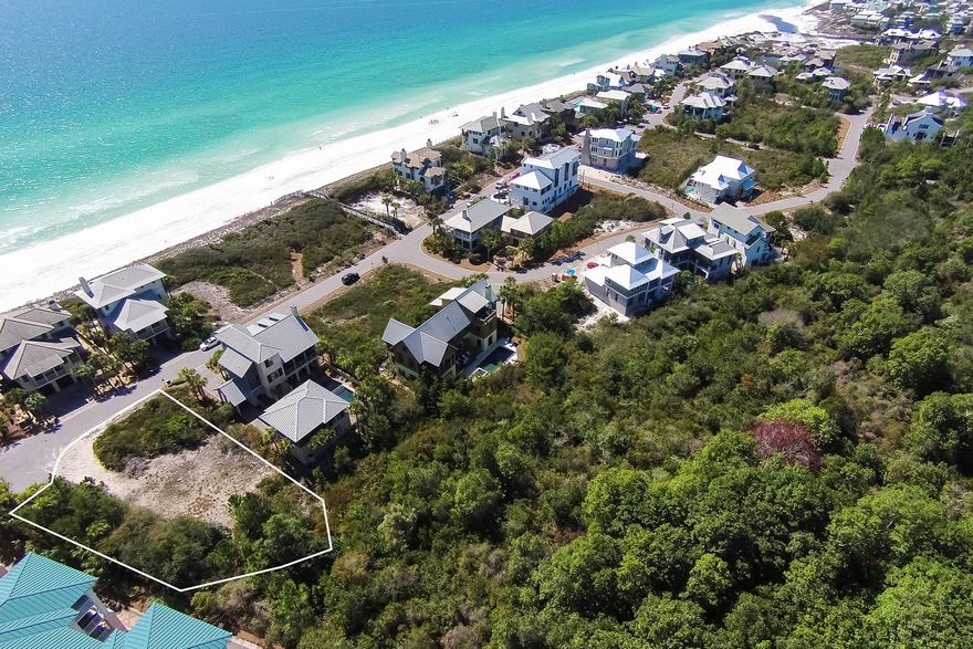 This large lot located directly across from 3,000 feet of private beach in The Retreat offers opportunity for view corridors between amply spaced Gulf Front homes. The Retreat, nestled between acres of nature preserve, the Gulf of Mexico, and a rare coastal dune lake is one of the few truly residential communities along scenic 30-A. This gated, rental restricted community offers a high level of privacy and seclusion. Owners enjoy a beautifully designed Beach Club with beach side infinity pool, ample pool deck with shaded dining areas, changing/restrooms, and private storage lockers for storing beach gear. There is also a canoe launch and picnic pavilion on Draper Lake which borders the community on the west side. And there is no required build out time!
