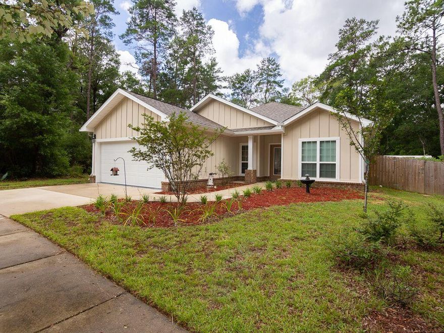 Better than new! This home has been impeccably maintained and is full of upgrades. Granite countertops in kitchen and both baths, beautiful wood floors in entryway, living room, family room, master bedroom and one guest room. Eat-in kitchen has plenty of cabinets and is open to the family room. The living room off the front of the home would also make a great office or formal dining room. Upgraded front door and tray ceilings are just a few of the other upgrades this home has. You will enjoy listening to the birds chirp in your private backyard that overlooks the wooded LaGrange Landing common area. You also have a privacy fence surrounding the back/side yards and a double gate on one side of the home. Indulge in fruit from your fig tree and grape vines. There is a termite bond in place. LaGrange Landing has a community pool and playground. All measurements are approximate and should be verified.