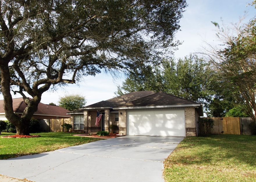 Low maintenance all brick home with large shady oak trees. Landscaped front and back yards. Access to the East Bay is a short walk away. Not in a special flood zone (does not require flood insurance). Room for boat parking in side yard. Large kitchen. Open floor plan. Master bath has double vanities. Both baths were updated in 2014 with new counter tops and sinks. Heat pump system and programmable thermostat in 2014; 10 yr warranty!New dishwasher. Fireplace. Split bedroom. Formal dining room with new pocket door offers flexibility as office or 4th bedroom. Blinds, washer/dryer, refrigerator, & range included. Walk-in closets in master/ his and hers. Large closets in other two bedrooms. Pantry in kitchen and large inside laundry room. Fig and orange tree.