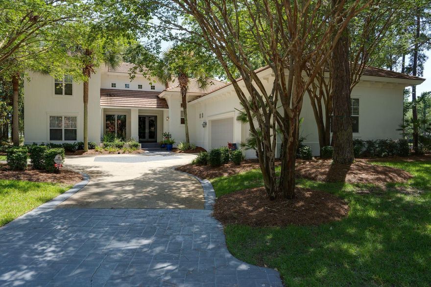 This remarkable Burnt Pine home includes 3 bedrooms and 3.5 baths on one of the prettiest water lots in Burnt Pine. Enjoy the tranquil views of the lake and landscaping from the screened in porch or side patio.  The beautifully renovated home includes two masters with one downstairs and one upstairs. . Entertaining is a breeze in this gated  Burnt Pine residence!  You'll love  the peaceful, unique location, with surprising privacy, and panoramic vistas of the #6 hole of the prestigious Burnt Pine golf course. Soaring ceilings, gorgeous trim, remodeled gourmet kitchen and the meticulous attention to maintenance make this an outstanding offering! The citrus trees with lemon, grapefruit, and oranges are an added bonus! Master bedroom include fire place and opens to the back patio.