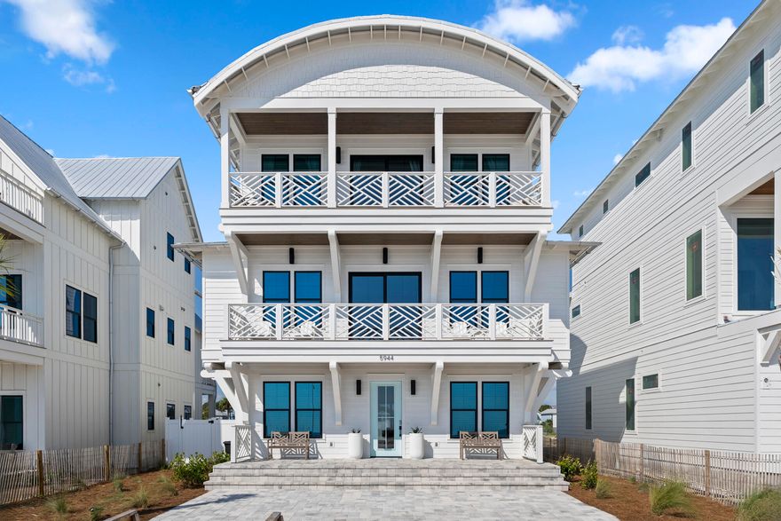 Perfectly positioned along the pristine shoreline of Panama City Beach, 5944 Gulf Drive presents a rare opportunity to own within an intimate Gulf-front enclave of just twenty-six residences. Designed and constructed by Thor Construction, this 4,747-square-foot retreat embodies refined coastal living with six bedrooms, six and a half bathrooms, and a thoughtful balance of private sanctuaries and gathering spaces. From the moment you enter, a sense of craftsmanship and scale is immediately evident. The kitchen serves as the heart of the home, appointed with custom cabinetry, premium appliances, a grand island for both culinary preparation and casual dining, and finishes that speak to timeless luxury. Expansive living areas are designed for both relaxation and entertaining, opening effortlessly to views that frame the turquoise waters beyond.

The third-floor primary suite crowns the residence, offering a serene retreat with sweeping outlooks, while the generous bunk roomfeaturing a custom-built king bunk and two twin bunks elevates hosting capacity without compromising comfort or design, creating a rhythm of privacy and ease for family and guests alike.

Outdoors, a fenced backyard invites the enjoyment of Gulf breezes in a more intimate setting, complete with a refreshing outdoor shower ideal for rinsing off after a day on the sand. Just steps away, the private development's sixteen Gulf-front and ten first-tier homesites capture the essence of coastal prestige.

More than a residence, this home represents an architectural expression of seaside elegancecrafted for those who value design, livability, and an incomparable sense of place.