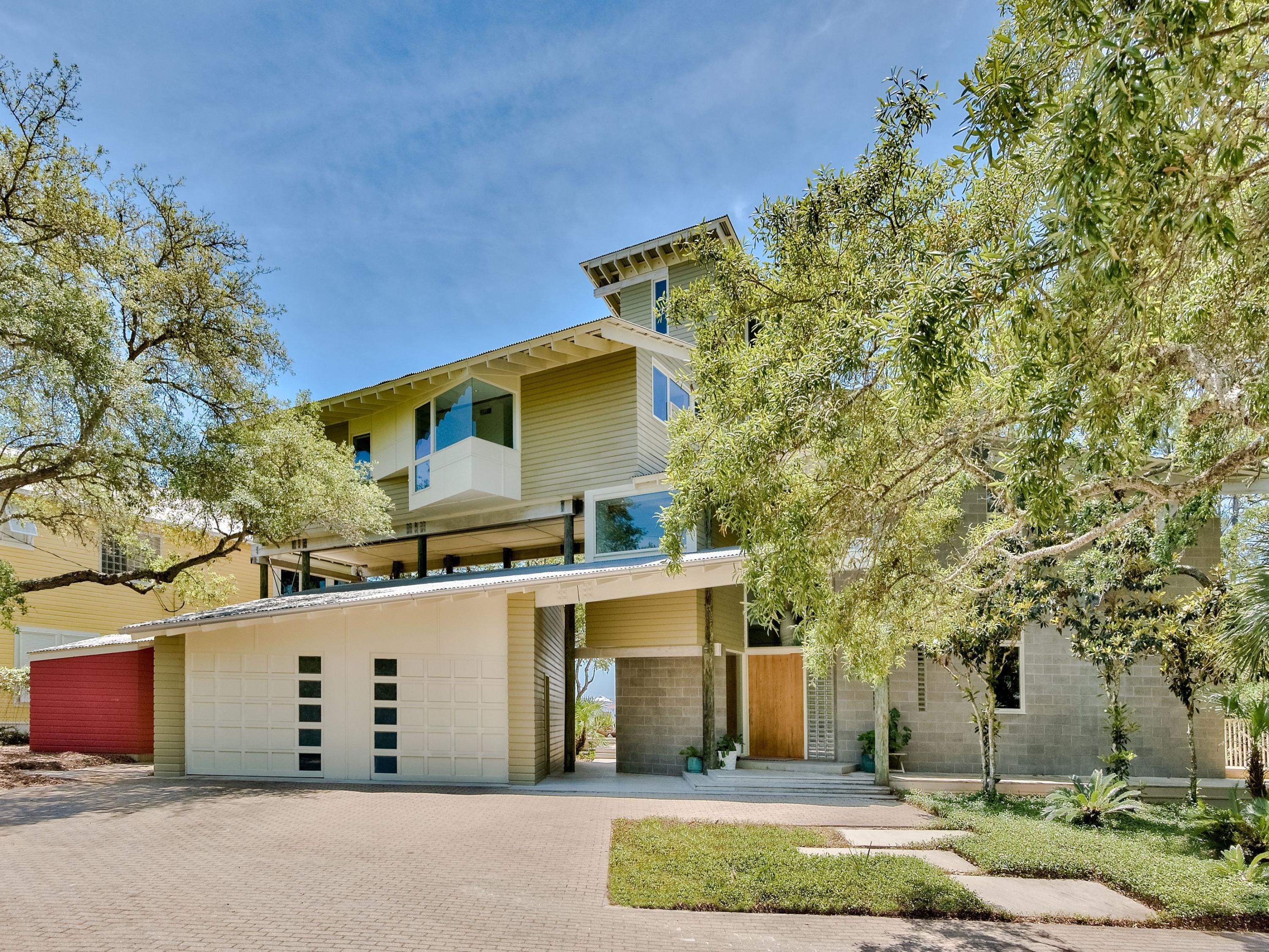 An architectural masterpiece created by renowned architect Steven Shortridge, is located on a rare coastal dune lake cradling the Gulf of Mexico. The property's natural surroundings are highlighted with expansive windows and extraordinary outdoor living spaces. A dramatic entry, towering pole columns and angled Cypress beams command attention from the moment you step inside. An open floor plan offers comfortable entertaining spaces, and the living room features ''Noon Day Prayer,'' a large original painting by well-known artist Darren Waterston. Take in beautiful views from several porches and decks including a fourth-floor tower that offers cinematic views of Eastern Lake and the gulf.