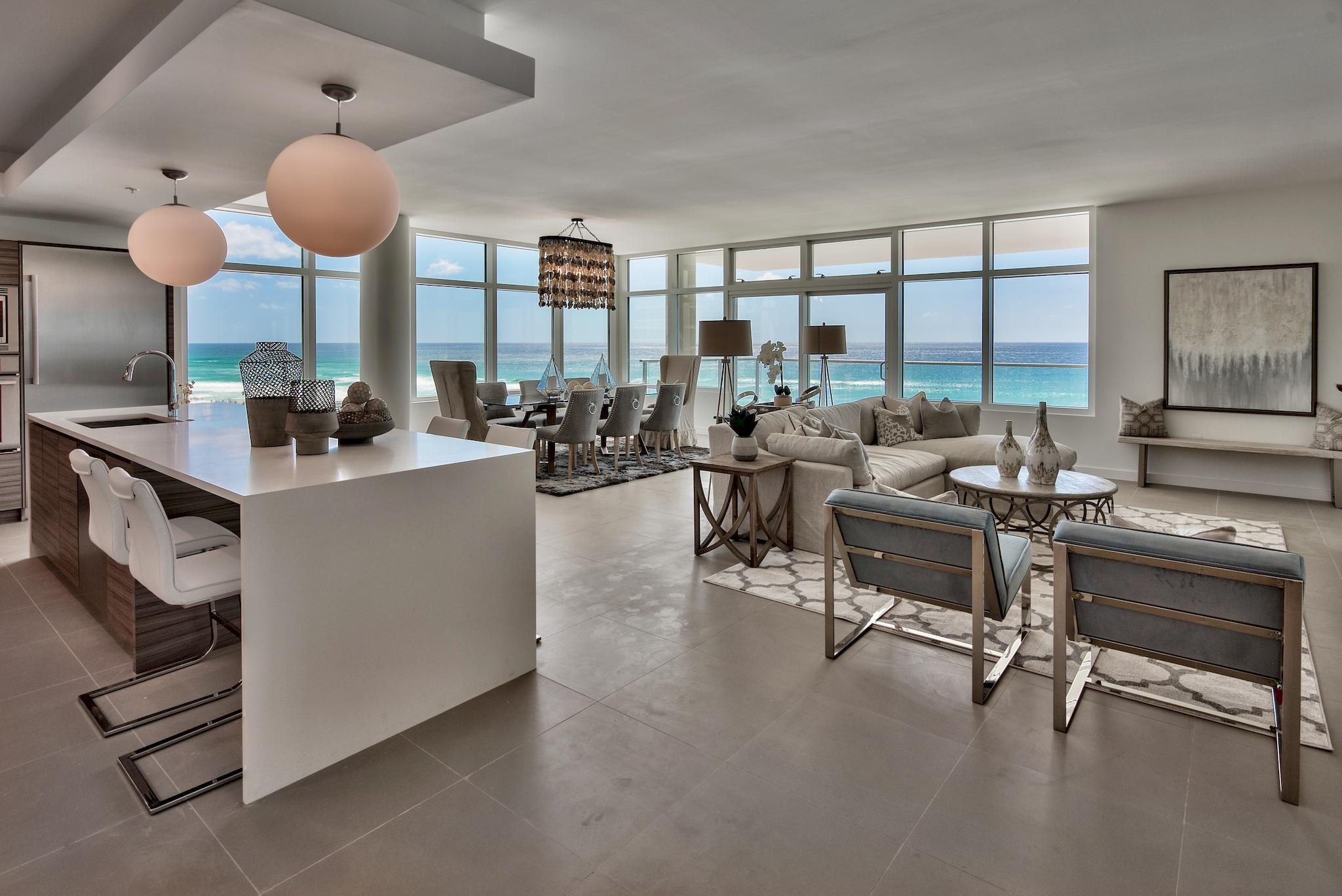Luxury at the Beach, Welcome to 1900 98. Each exquisitely designed luxury residence features a panoramic view of the Gulf of Mexico from its private, 12-foot deep balcony equipped with an electric grill. The open plan with clean, flowing lines invites beams of natural light inside through an expansive wall of windows. Interior design elements that include custom cabinetry, marble and quartz countertops, Thermador kitchen appliances and porcelain stone floor tile makes this three bedroom, three bath residence truly incredible. Amenities include a rooftop pool, spa, fire pit & state of the art fitness center, along with gated entry, heated and cooled elevator and lobby areas and two levels of parking beneath the residences.
