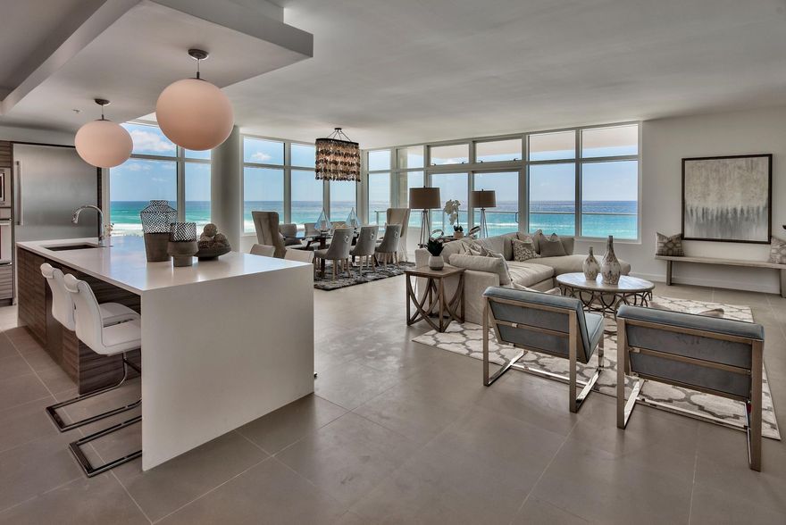 Luxury at the Beach, Welcome to 1900 98. Each exquisitely designed luxury residence features a panoramic view of the Gulf of Mexico from its private, 12-foot deep balcony equipped with an electric grill. The open plan with clean, flowing lines invites beams of natural light inside through an expansive wall of windows. Interior design elements that include custom cabinetry, marble and quartz countertops, Thermador kitchen appliances and porcelain stone floor tile makes this three bedroom, three bath residence truly incredible. Amenities include a rooftop pool, spa, fire pit & state of the art fitness center, along with gated entry, heated and cooled elevator and lobby areas and two levels of parking beneath the residences.
