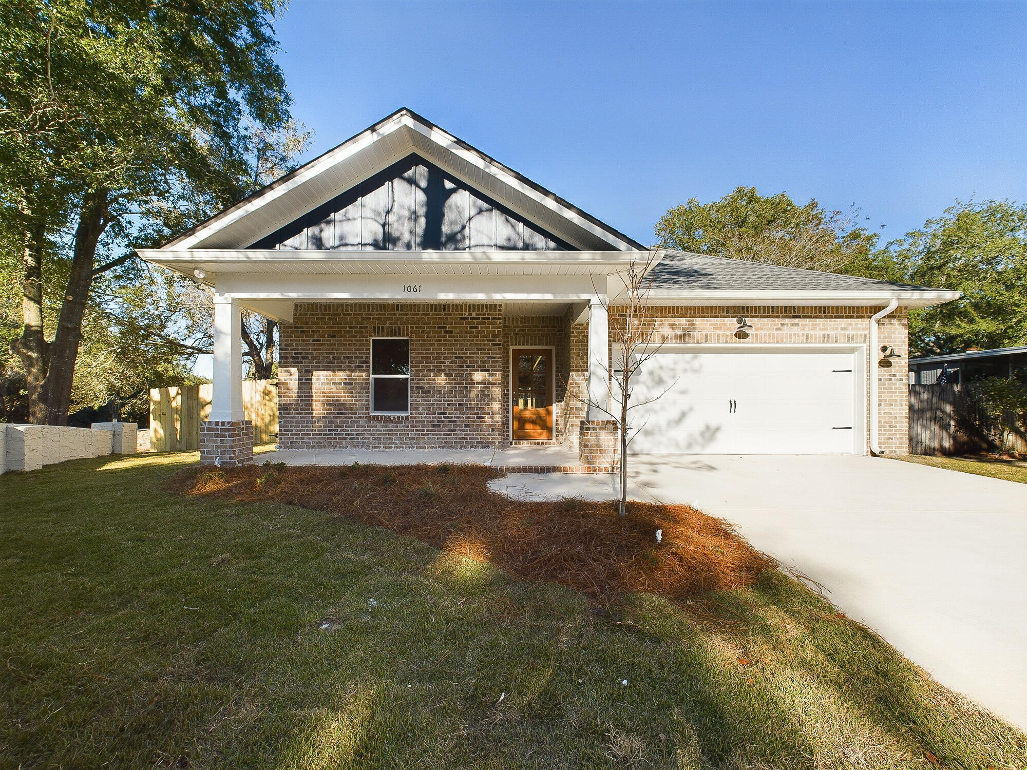 *Note: Pictures are of a home by the same builder with similar finishes & floor plan. Some details depicted may not be exactly the same. Property is still under construction but could close by end of year!! Experience the epitome of modern living in the heart of Niceville with this stunning new construction 4-bedroom, 2-bathroom home!! This craftsman style home features all the luxuries of modern living including an open-concept layout, vinyl plank flooring, and even access to the laundry room from the master bedroom closet. The kitchen is a chef's delight, featuring solid wood shaker cabinets, quartz countertops, a stylish tile backsplash, and a spacious corner pantry. The kitchen island, adorned with pendant lights, serves as a captivating centerpiece, while steel appliances, including a side-by-side refrigerator, complete the package. Retreat to the master suite, where a trey ceiling and an expansive ensuite and walk-in closet await with access to laundry room!!!. Step outside to the private backyard oasis, where a lush lawn and a covered patio await, offering an ideal space for outdoor gatherings.