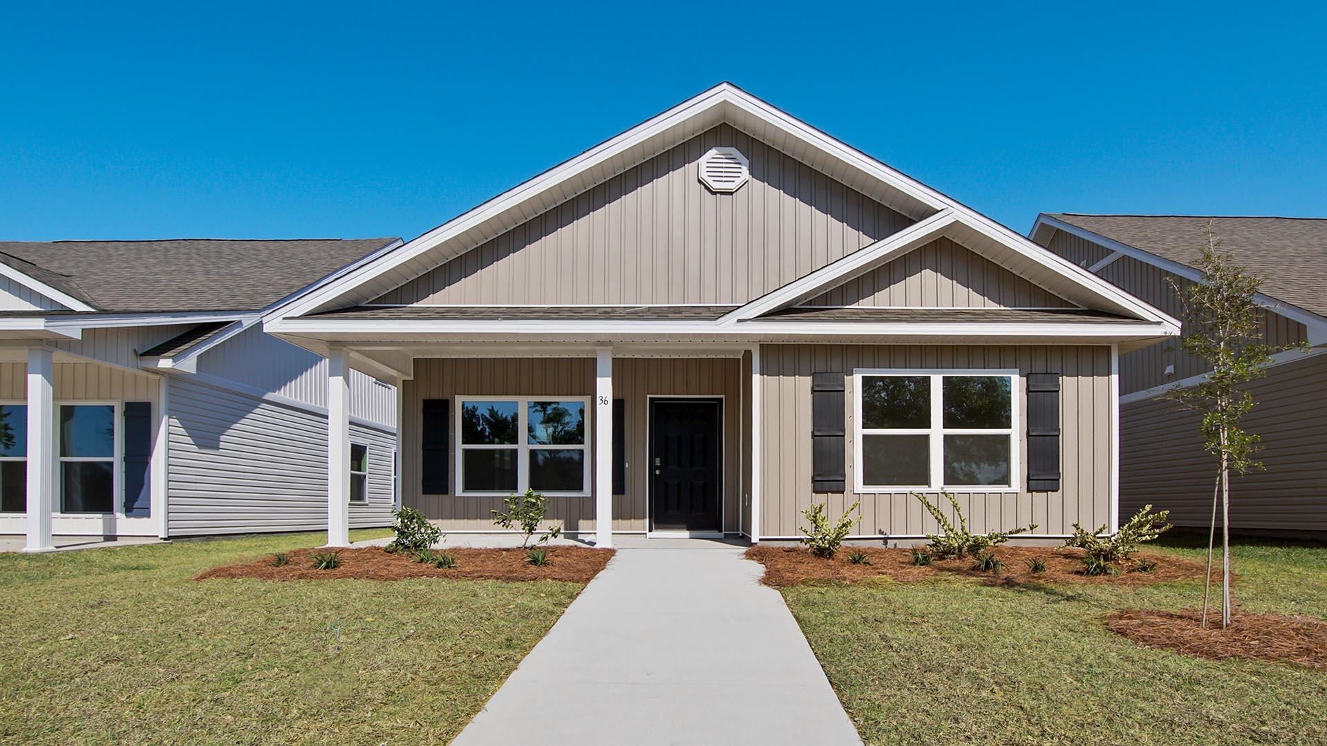 The Owl's Head community is conveniently located off of Highway 331 in Freeport. We are only 8 miles to Interstate 10, and 16 miles to beautiful beaches and Highway 30 A. We offer 6 floor plans, 3 and 4 bedrooms. All homes have rear entry garages. This community offers a community area with paved walking trails and a spring fed lake. | The Porter plan is an open floor plan with 3 Bedrooms, and 2 bathrooms. It has a covered front porch. The primary bathroom has a separate shower and large soaking tub. Elegant, engineered vinyl plank flooring in the kitchen and living area pops against granite countertops and upgraded wall to wall carpet lines the bedrooms.