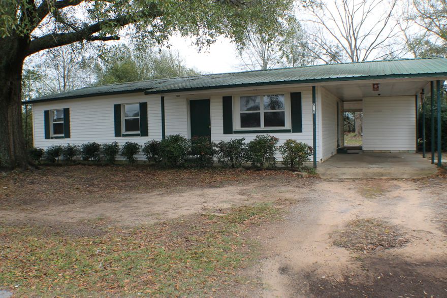 3/1 conveniently located to shopping with storage area off carport. Big back yard.