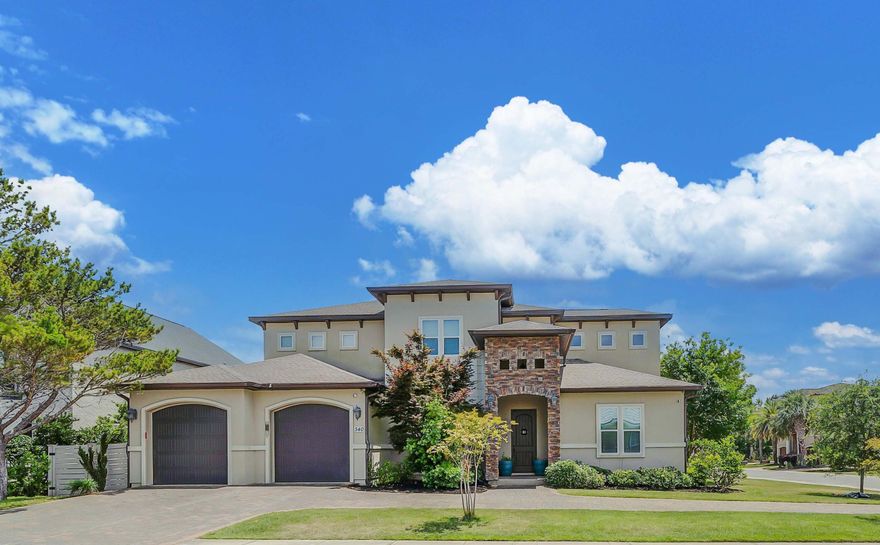 2.75% assumable mortgage! Brand New Roof on this 5 bedroom Bay Point Home! Breathtaking lagoon views, and gorgeous screened-in pool and lanai with outdoor kitchen!  Bay Point with 5 bedrooms, 4 full baths, and dedicated office. This 2016-built home features an ideal blend of elegance and comfort, making it perfect for family and entertaining guests. Key features include a gourmet kitchen with custom cabinetry, quartz countertops, a gas stove and double oven, coffee bar, and walk-in pantry. Enjoy your first-floor private primary suite with fabulous primary bath, featuring a walk-in shower, separate copper tub, double vanities, and a makeup area. Also on main level, you will find a second bedroom and full bath, as well as first floor office. You will appreciate custom built-ins i both the great room and office, offering both style and functionality. Several high-end finishes include hardwood floors, crown molding, and impact-resistant glass throughout. On the 2nd level you will find 3 more bedrooms and 2 more full baths. Take in unbelievable lagoon views from the upstairs glassed-in bonus Florida room. Step outdoors to an expansive outdoor space, including a custom pool with a paver deck, screen enclosure, and an outdoor kitchen - perfect for entertaining or relaxing. Come enjoy the Bay Point lifestyle and amenities where you can walk, bike and golf cart to access the Jack Nicklaus designed golf course, state of the art marina, a beverage or meal at Bar 72 Club House, and also enjoy close proximity to shopping, dining, and entertainment. This exceptional home is a true gem - call today!