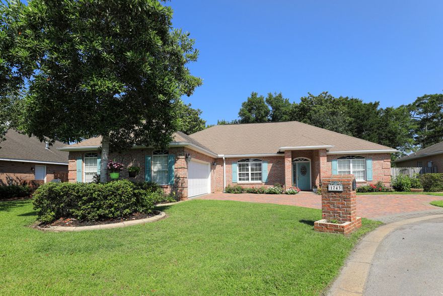 Beautiful 4/2 split floor plan that features a huge great room sitting area. New HVAC system, New Roof, New Gas Range, & New Microwave. All brick custom home with an amazing Florida room, immense kitchen to entertain, built by award winning builder in the sought after subdivision of Magnolia Forest. Take a quick stroll just a block away to the Bluewater Bay Marina, for all water enthusiasts. Ample 1/4 acre size lot in cul-de-sac, gorgeous paver driveway, lined with an array of flowers in front of larger than average 2 car garage. Fenced-in back yard provides privacy while sitting on the open patio having a cup of coffee. Utilize the retractable awning on those rainy days or relax in the hot tub to help some muscle soreness as you reflect on the daily impact from your hard work